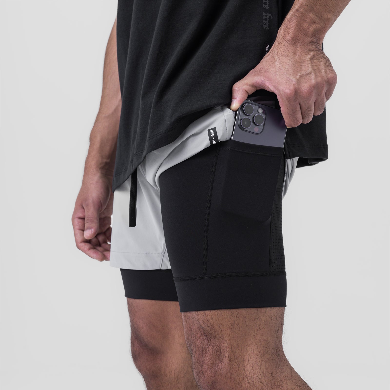Tetra-Lite 5" Liner Short in Slate Grey and Black, worn by model holding phone in pocket