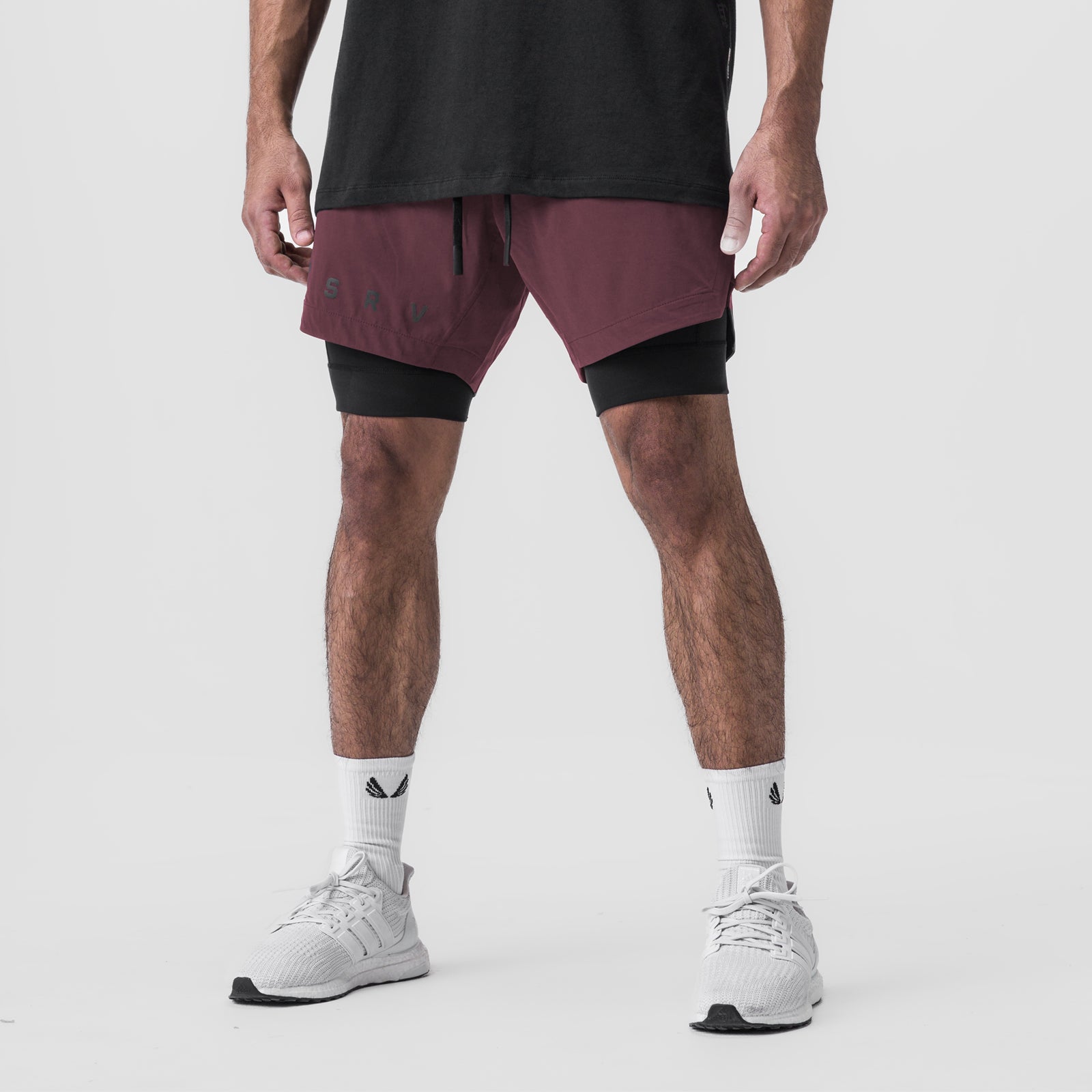 Tetra-Lite 7" Liner Short in plum and black, worn with white sneakers and socks, front view