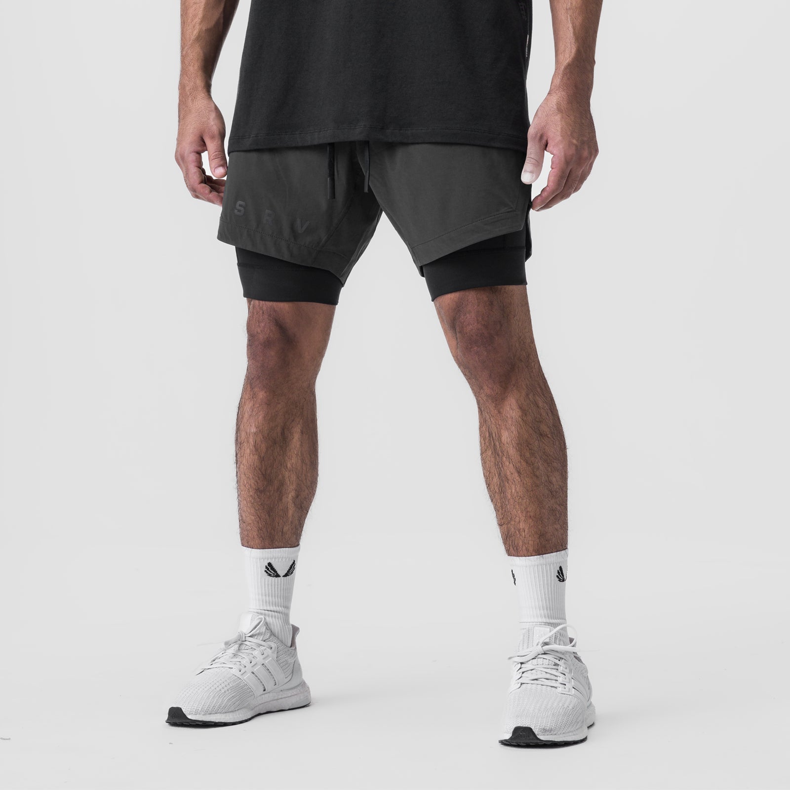 Tetra-Lite 7" Liner Short in Space Grey and Black, modeled from waist down with white sneakers