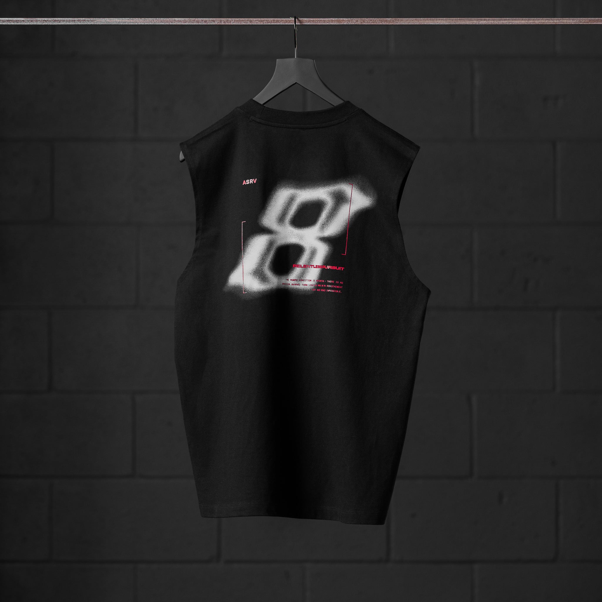 Black Tech Essential Relaxed Cutoff sleeveless tank with 'Infinite Mindset' graphic, back view on hanger