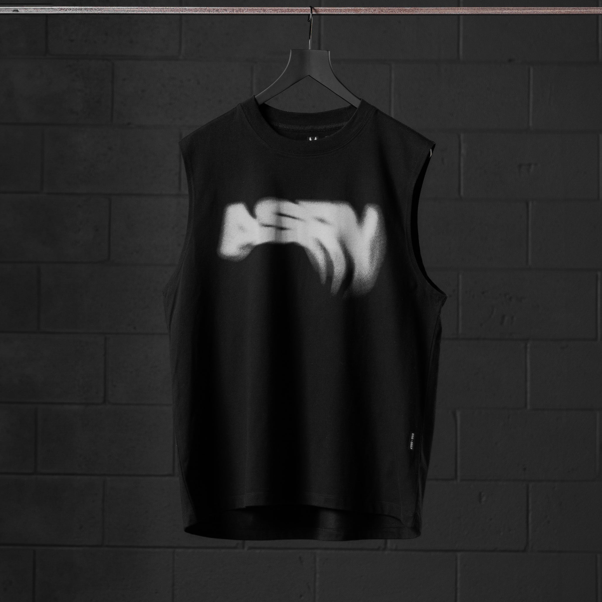 Black Tech Essential Relaxed Cutoff tank top with 'Signal Lost' graphic on hanger