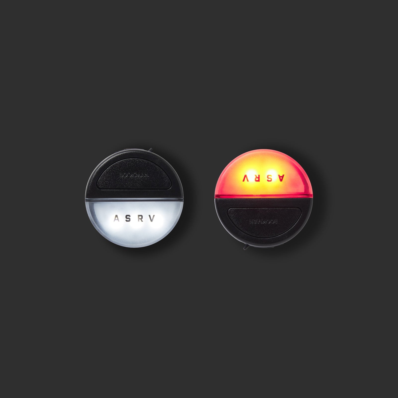 flatlay of ASRV x Bookman Eclipse lights in black and white, front view