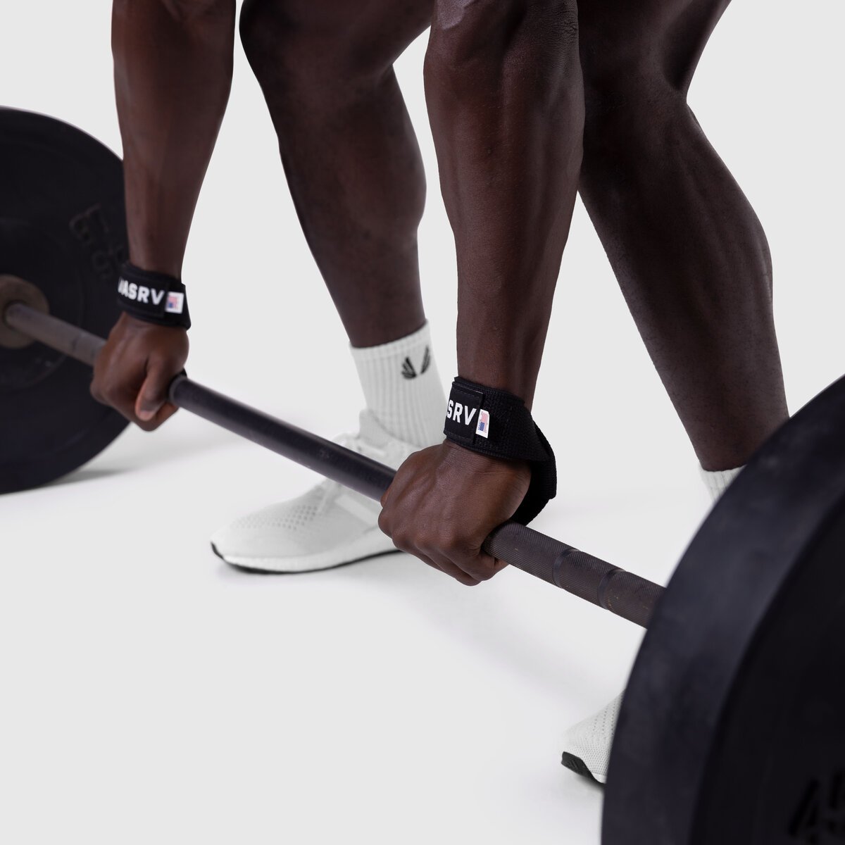 Padded Lifting Straps in black worn on wrists during deadlift exercise