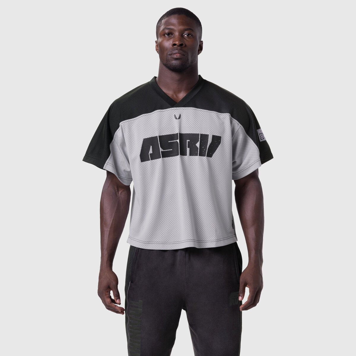 Ion-Mesh Crop Jersey in slate grey and black, worn by male model, front view