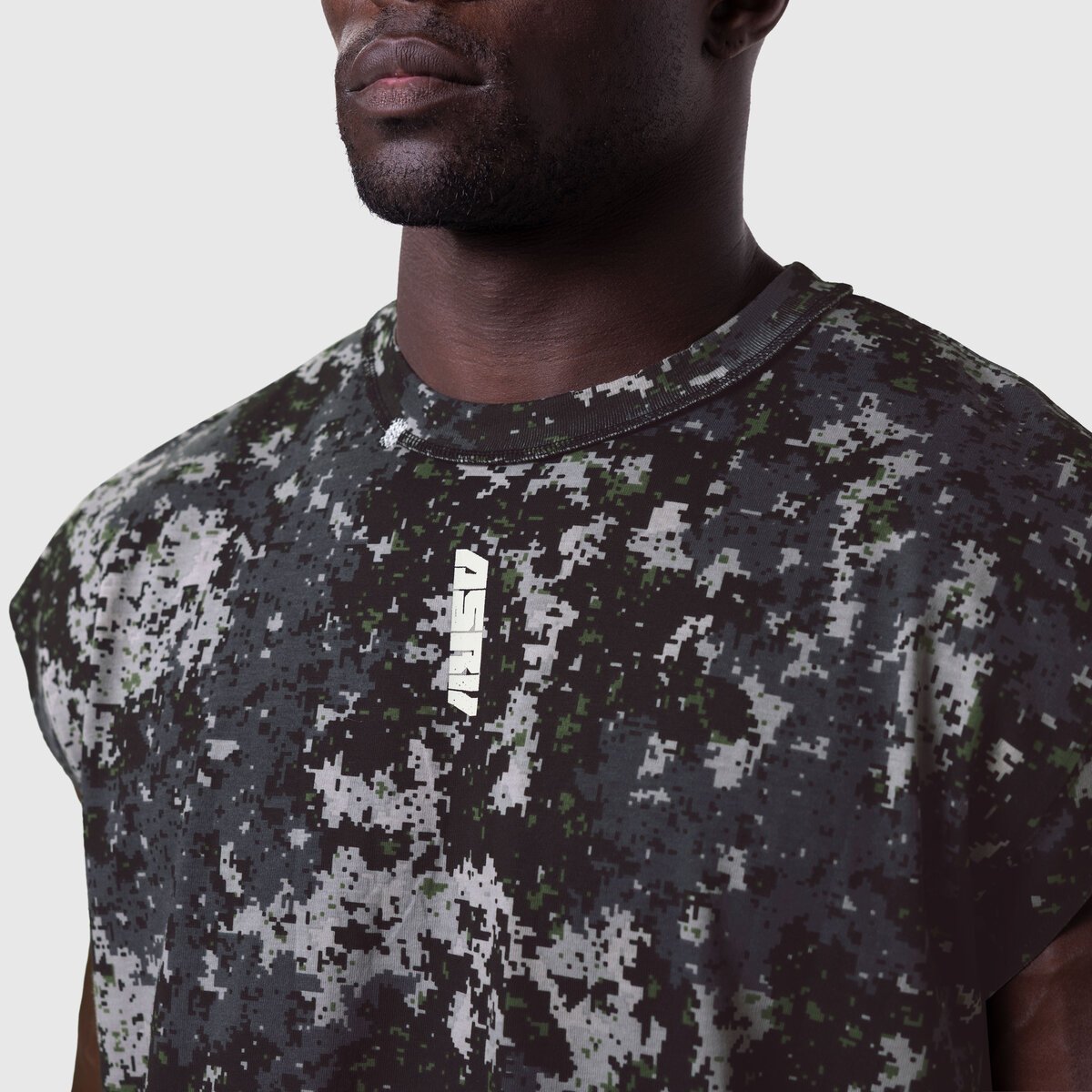 Tech Essential Cap Shoulder Cutoff in Pixel Camo worn by model, front view