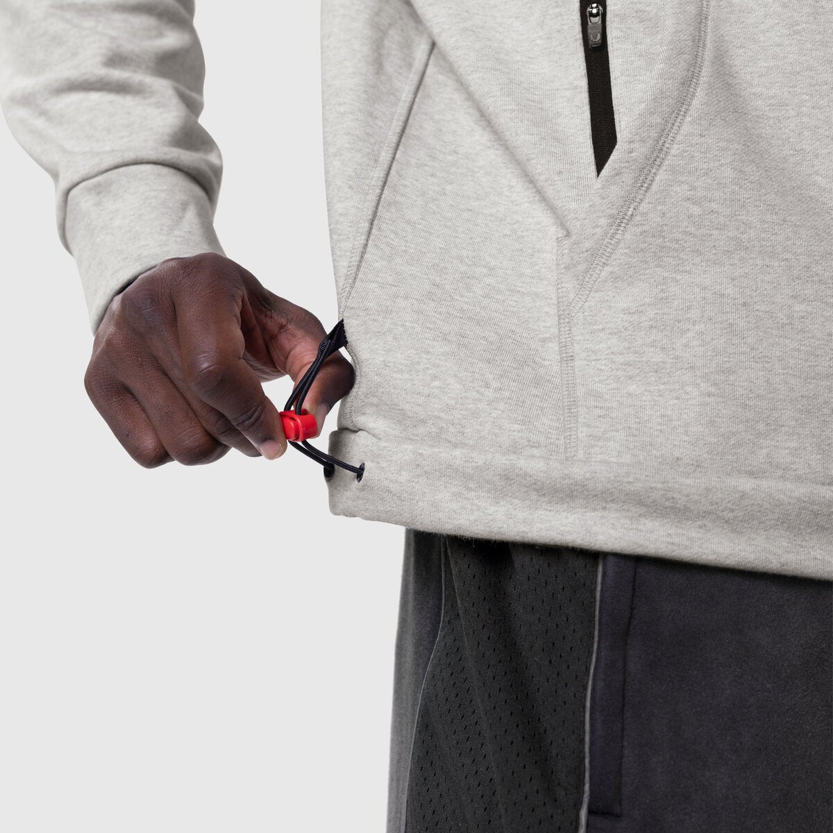 Tech-Terry Training Hoodie in Heather Grey, model holding drawstring detail