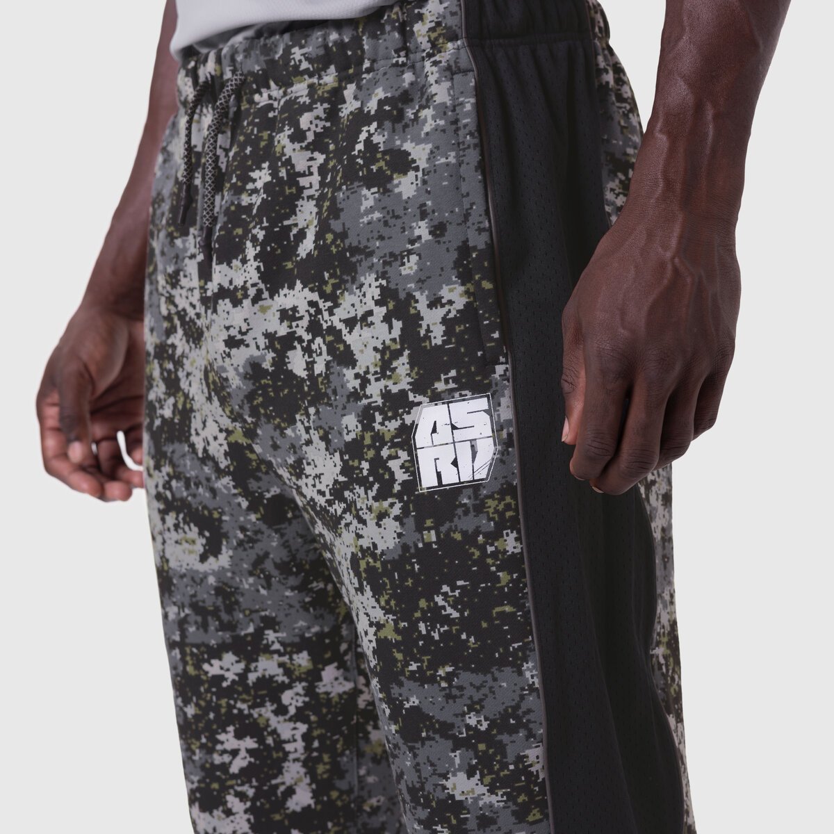 Tech-Terry Mesh Panel Sweats in pixel camo, worn by model showing side detail