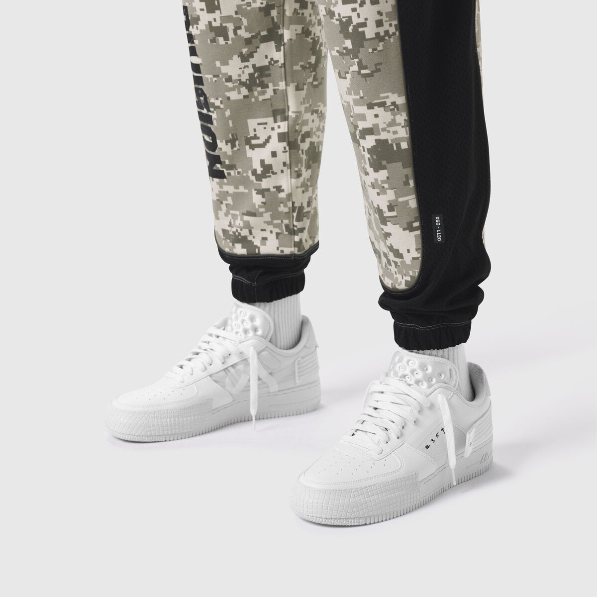 Tech-Terry Mesh Panel Sweats in digital camo, worn with white sneakers, lower body view