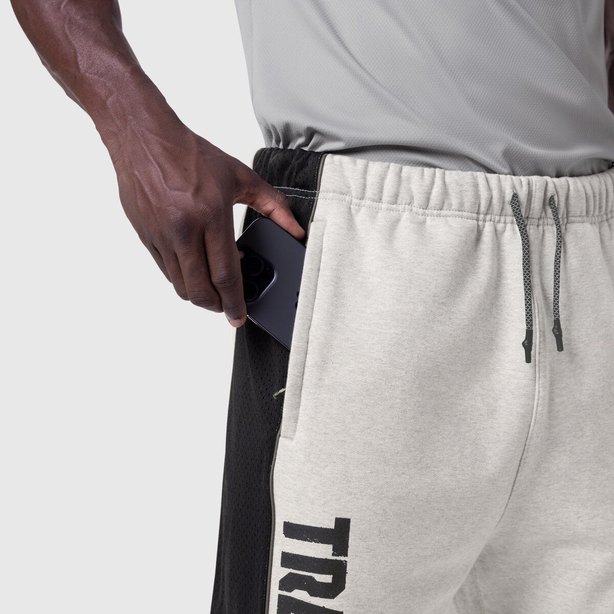 Tech-Terry Mesh Panel Sweats in heather grey, model wearing with hand in pocket detail