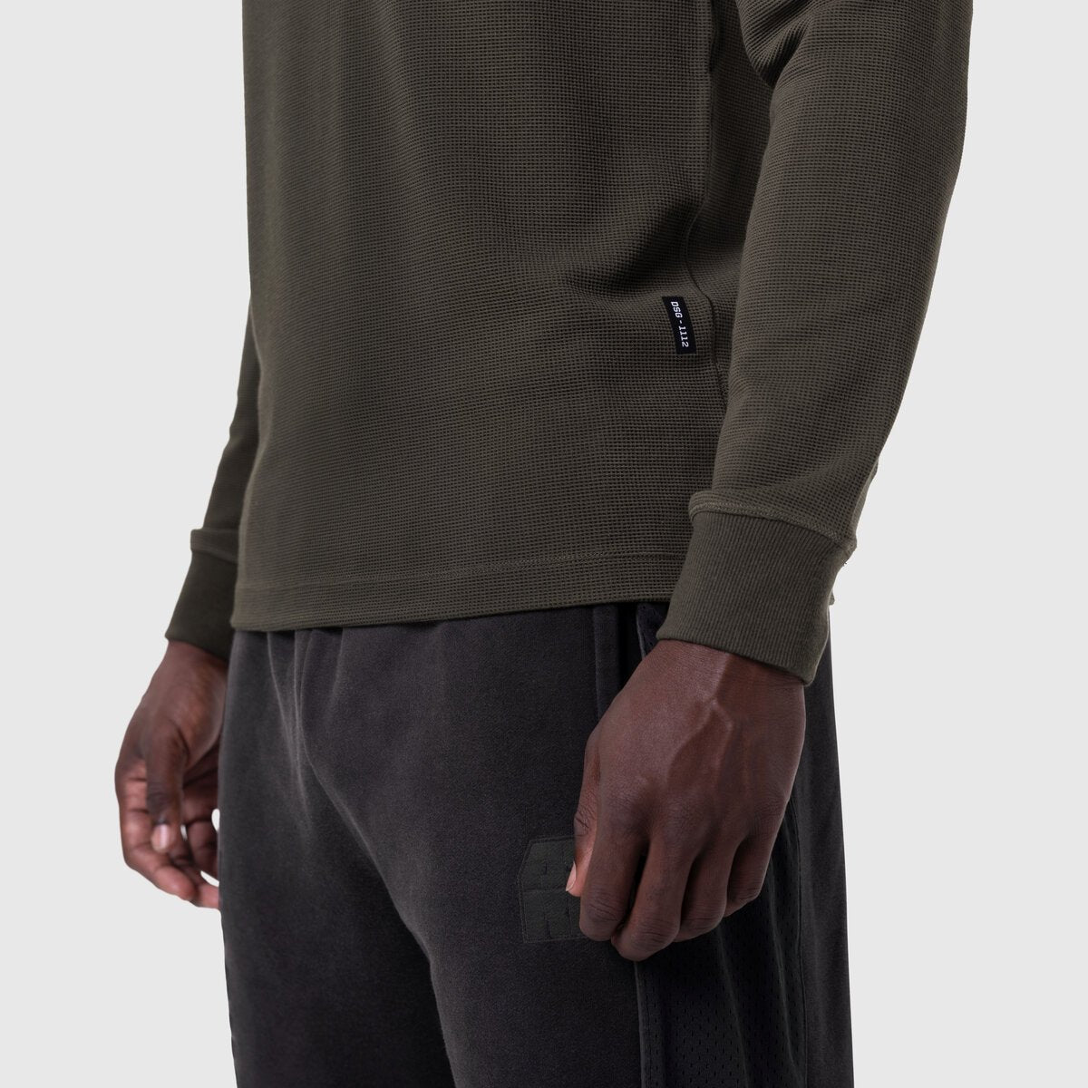 Waffle knit longsleeve in olive worn by model, side view