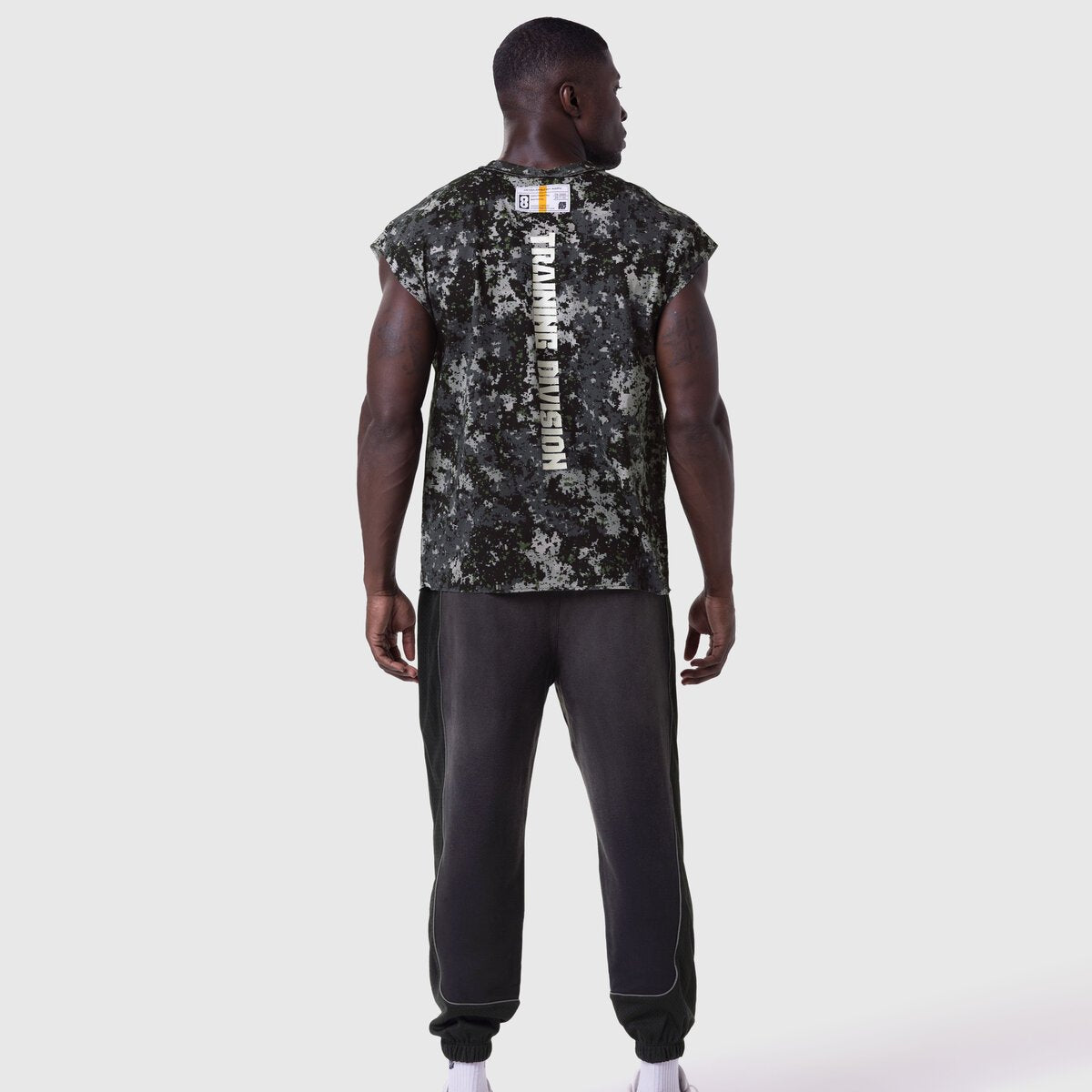 Tech Essential Cap Shoulder Cutoff in Pixel Camo worn by model, back view