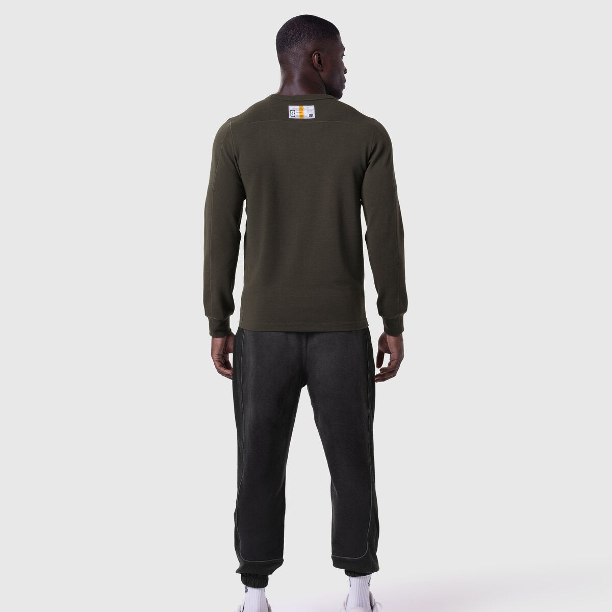 Waffle knit longsleeve in olive worn by model, back view