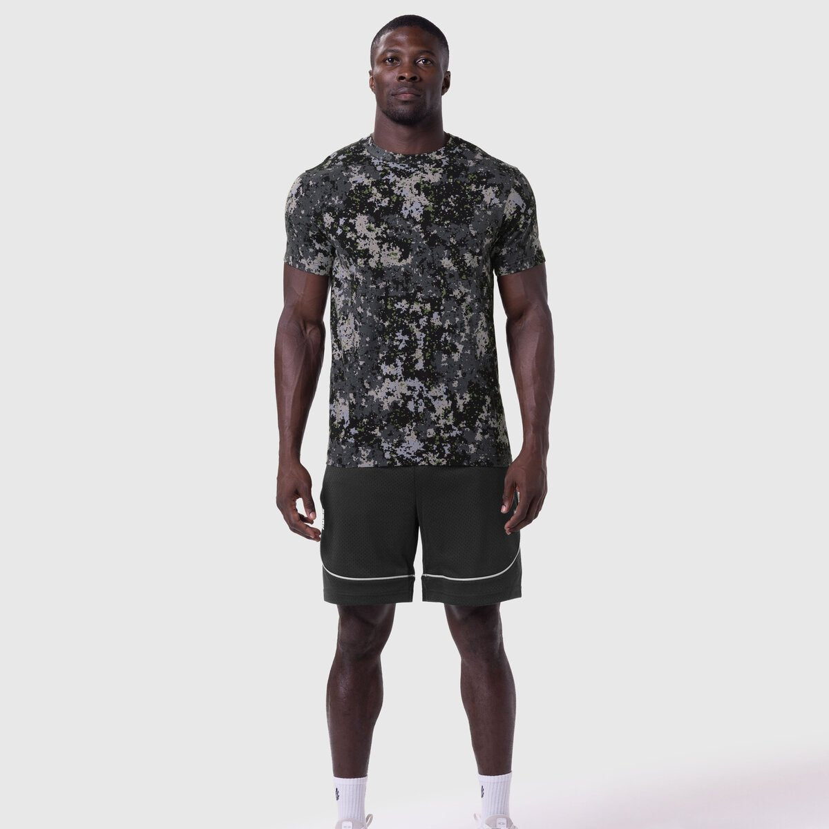 Supima Essential Tee in pixel camo worn with black shorts, front view on model