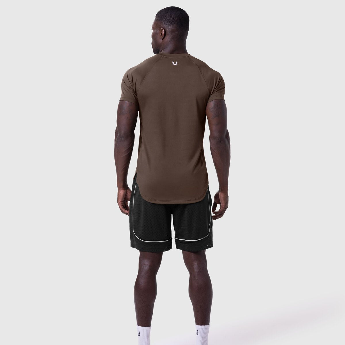 AeroSilver Established Tee in Dark Earth worn with black shorts, back view