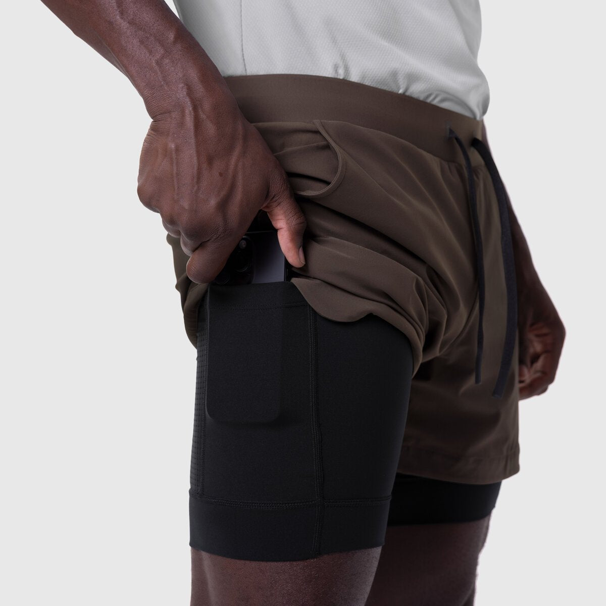 Tetra-Lite 5" Liner Short in Dark Earth and Black, side view on model