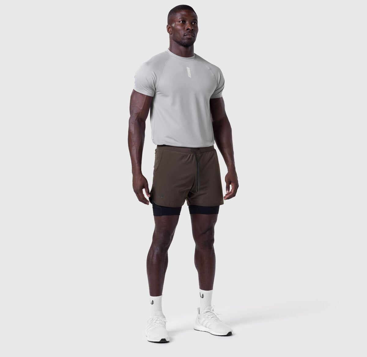 Tetra-Lite 5" Liner Short in Dark Earth and Black, worn by model standing facing forward