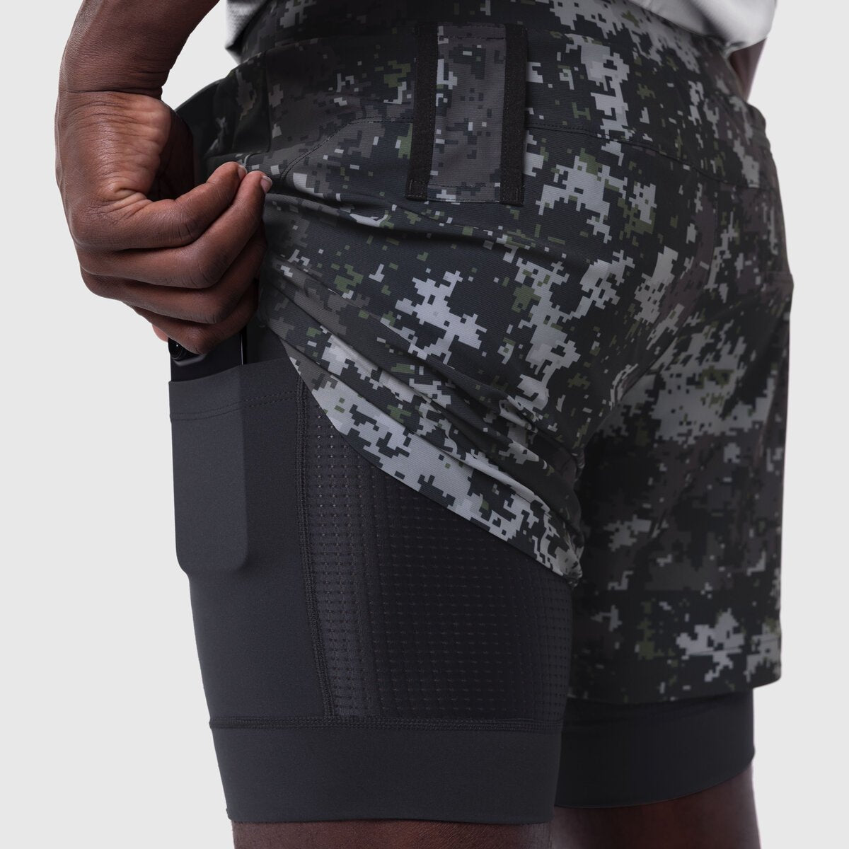 Tetra-Lite Liner Short in Pixel Camo Wings/Black worn by model, side pocket detail view