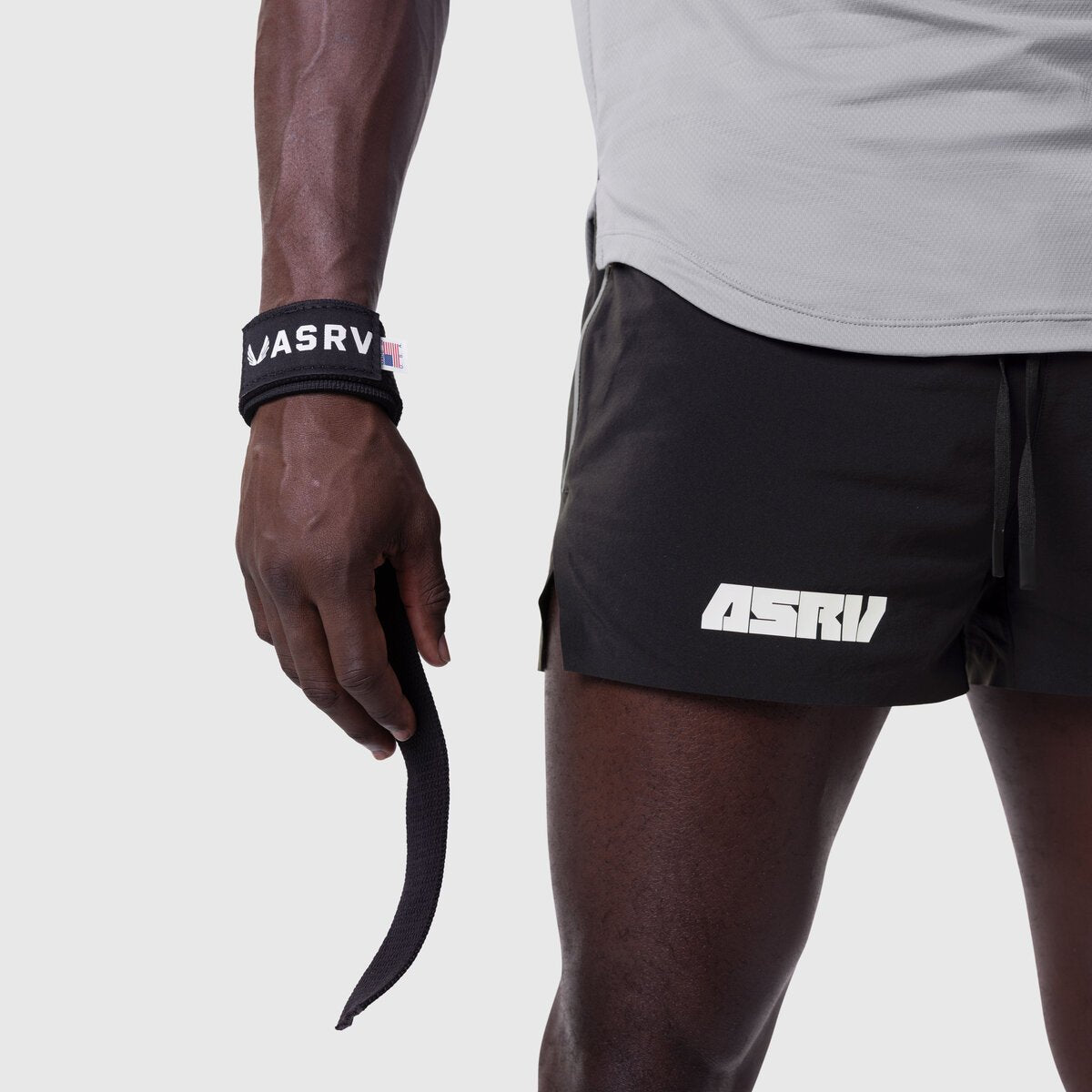 Padded Lifting Straps in black worn on wrist, styled with ASRV shorts and tank top
