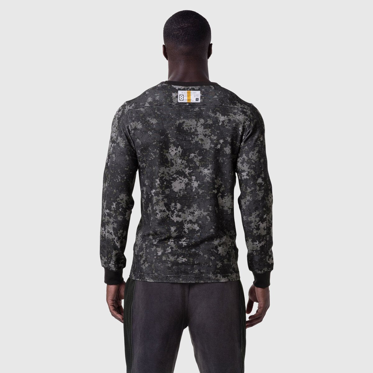 Waffle Knit Longsleeve in pixel camo black, worn by model shown from behind