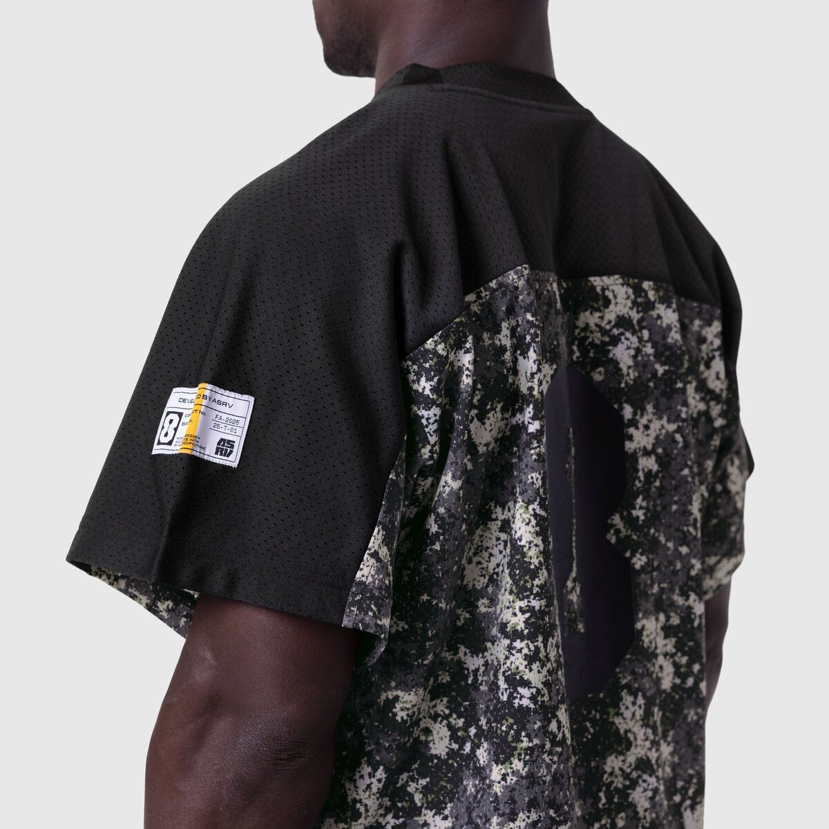 Ion-Mesh Crop Jersey in black with pixel camo back panel, worn by model, back view