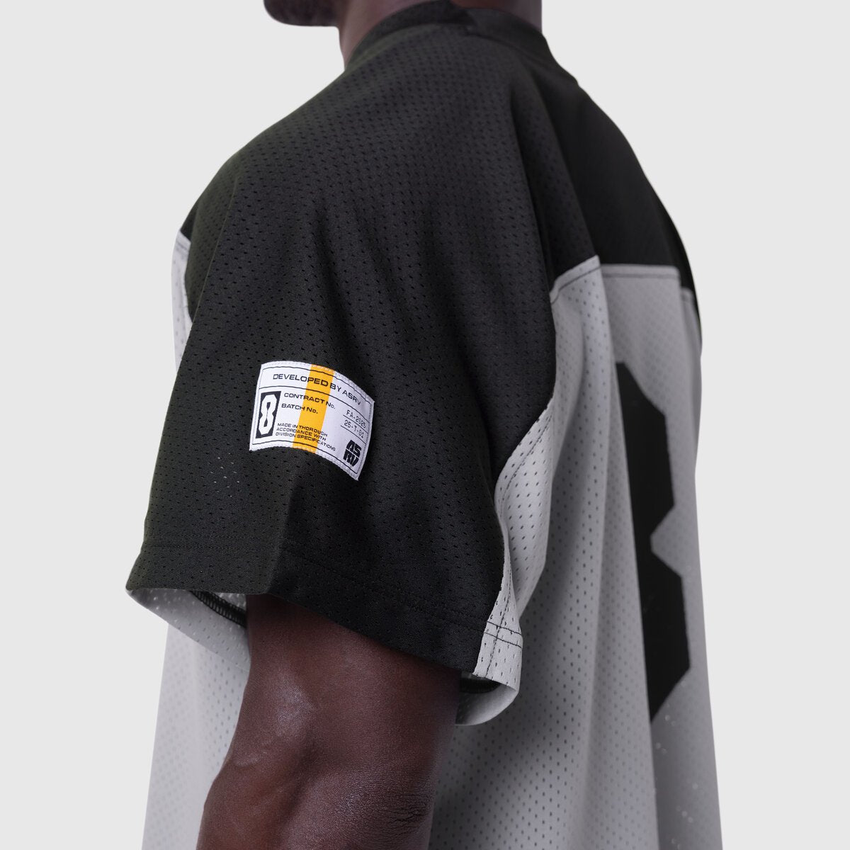 Ion-Mesh Crop Jersey in slate grey and black colorblock, worn by model showing back and side view
