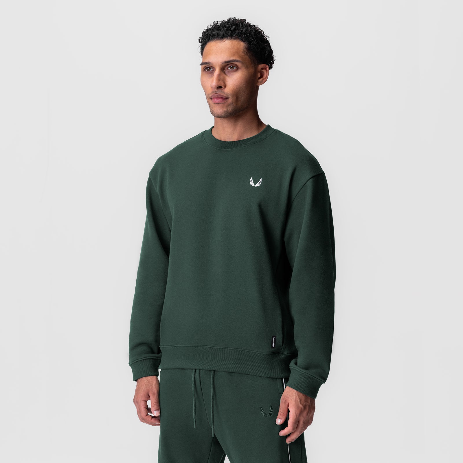 Herringbone Terry Crewneck in forest green worn by male model, front view