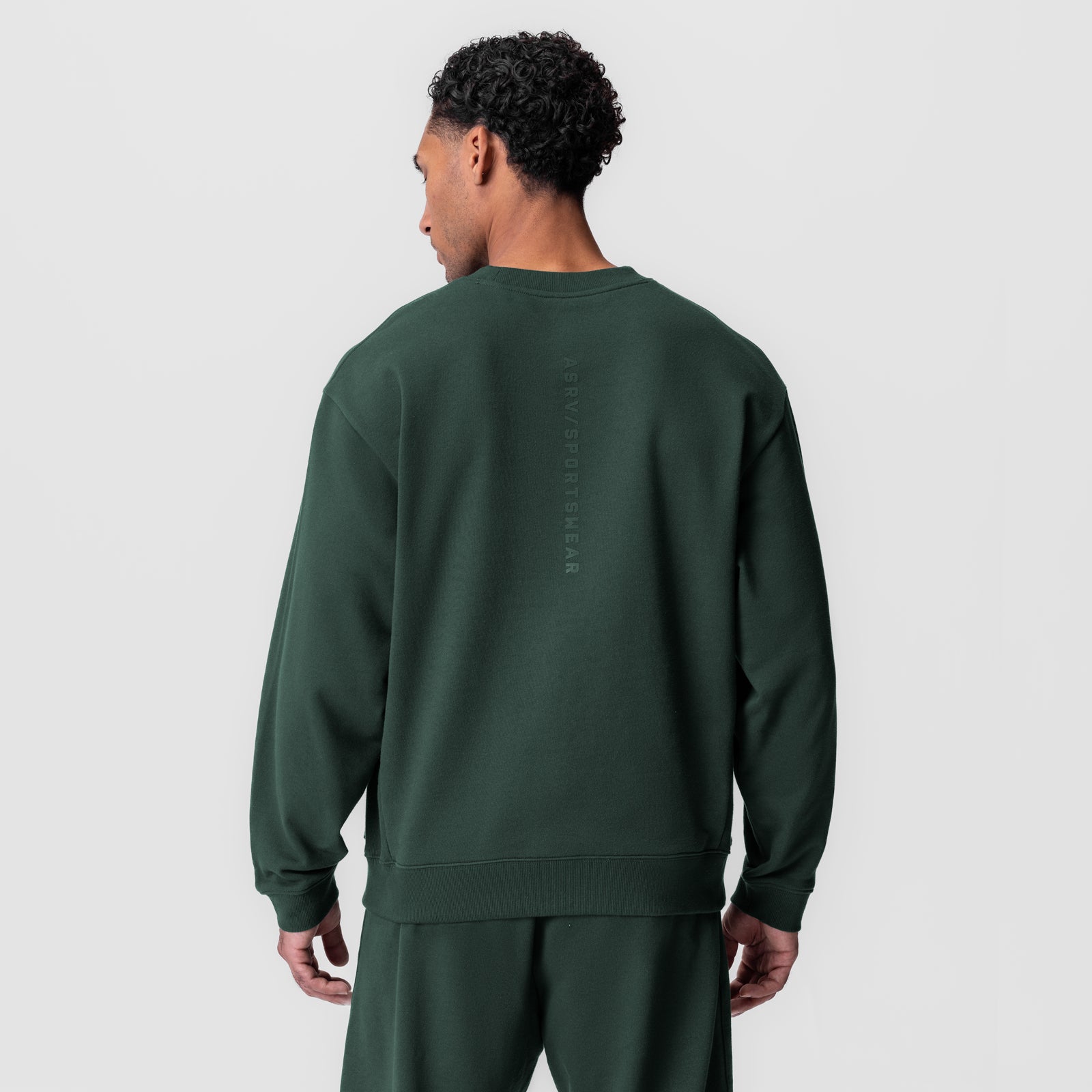 Herringbone Terry Crewneck in forest green, back view on model