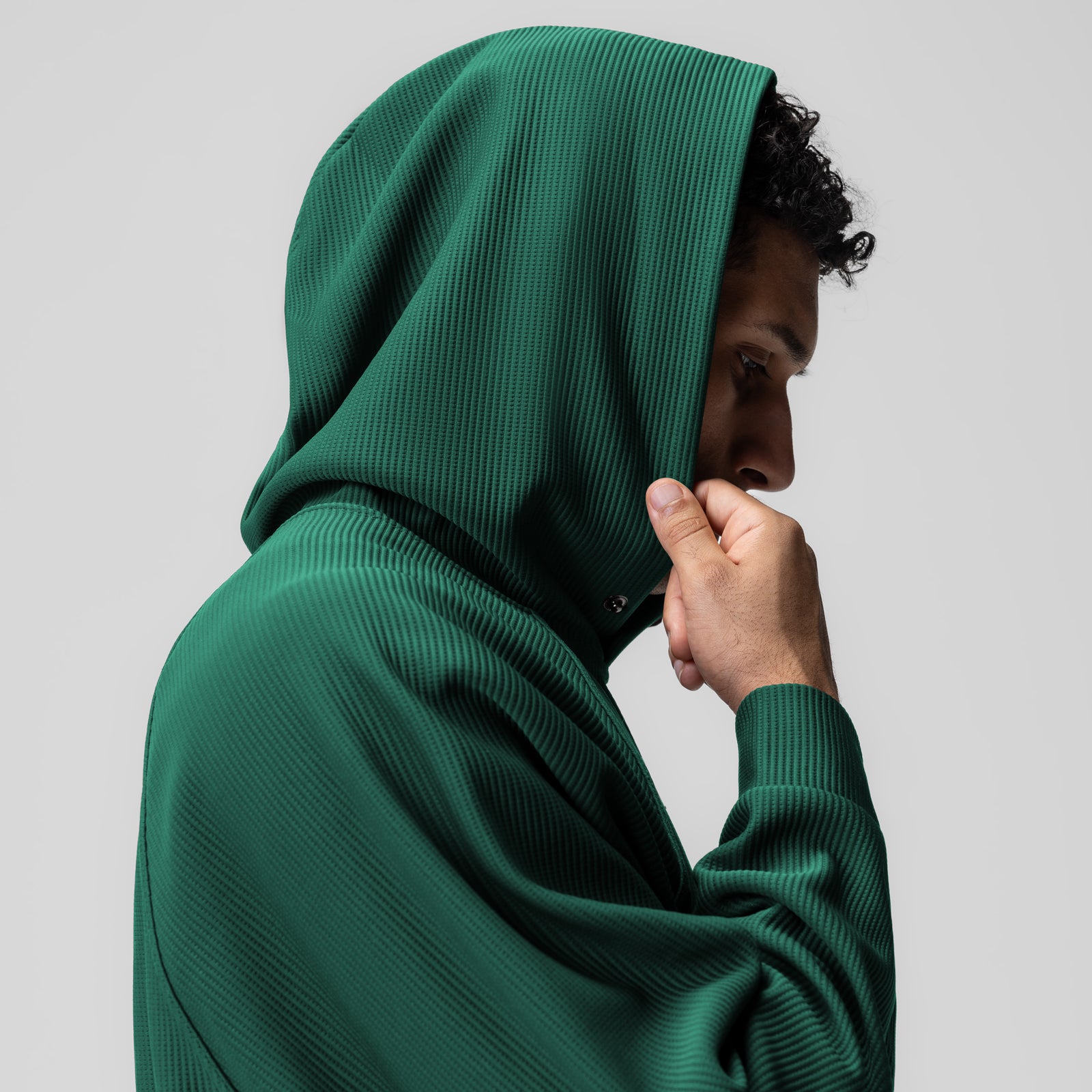 Deltapeak® Oversized Hoodie in forest green, worn by model in profile with hood up