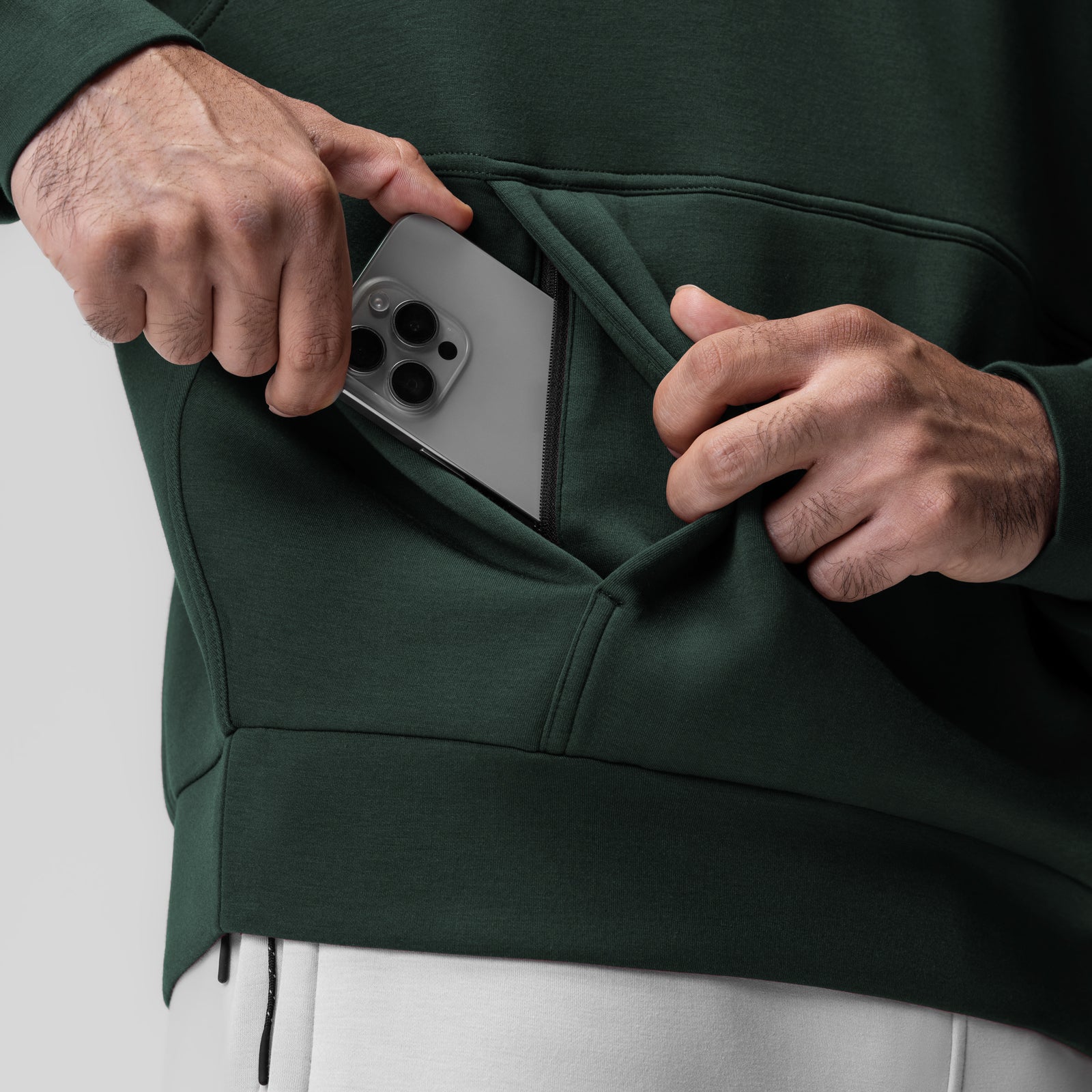 Dri-Core™ Oversized Crewneck in Forest Green, model wearing hoodie with phone in pocket