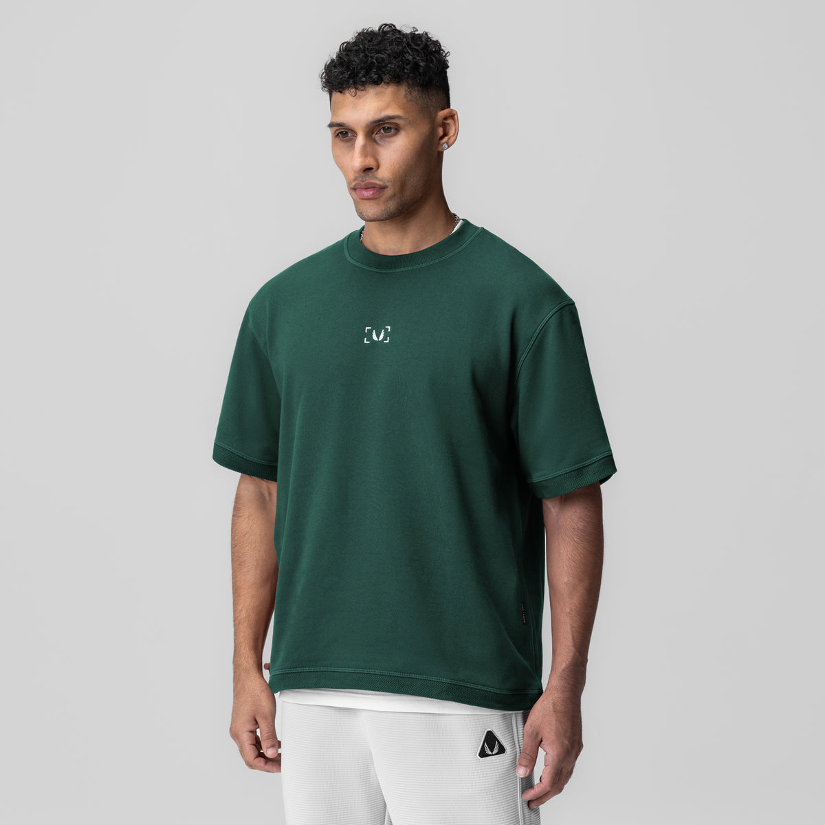 Herringbone Terry Oversized Cinch Tee in forest green, worn by model, front view