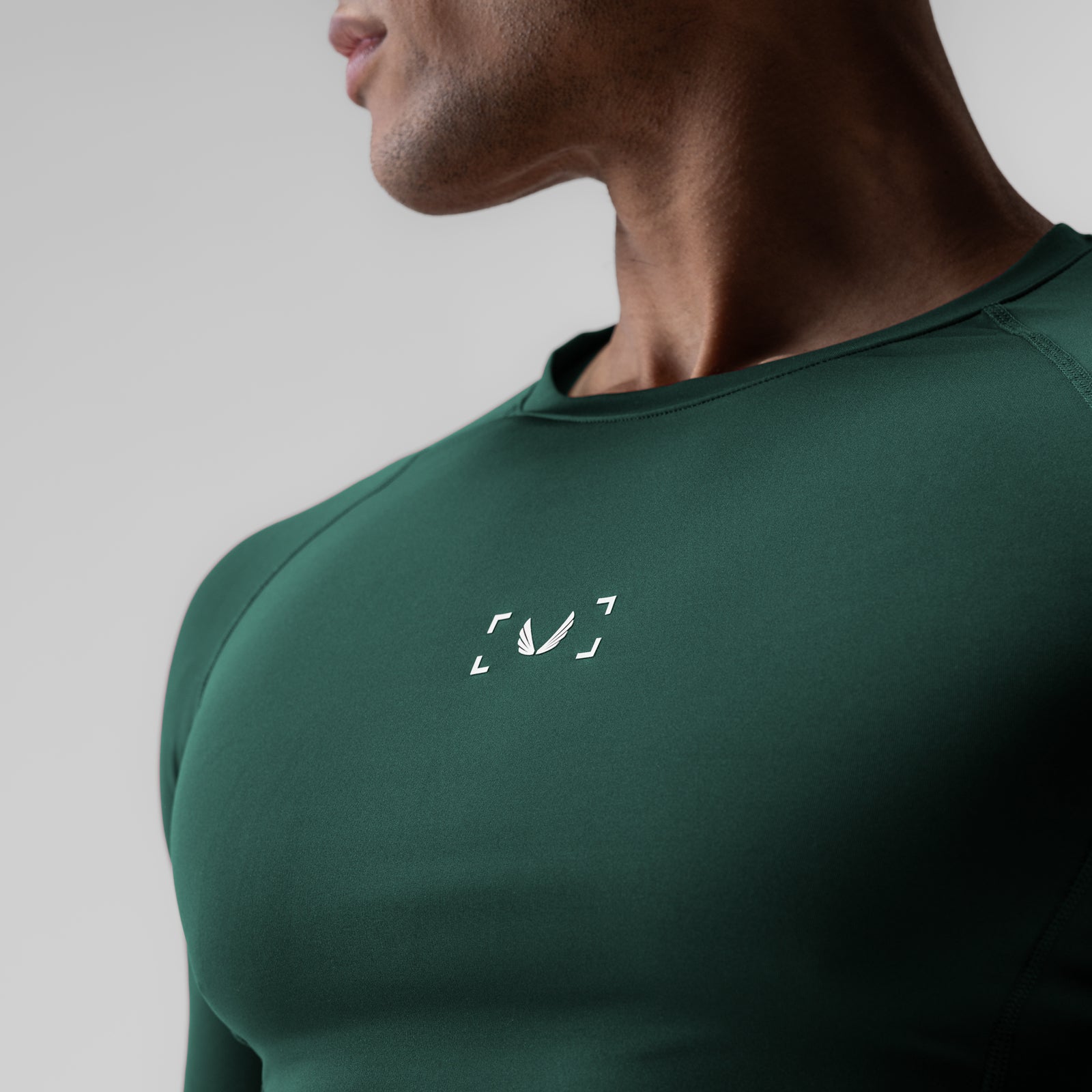 WarpFlexx-Lite® Half-Sleeve Baselayer in forest green, worn by model in profile view