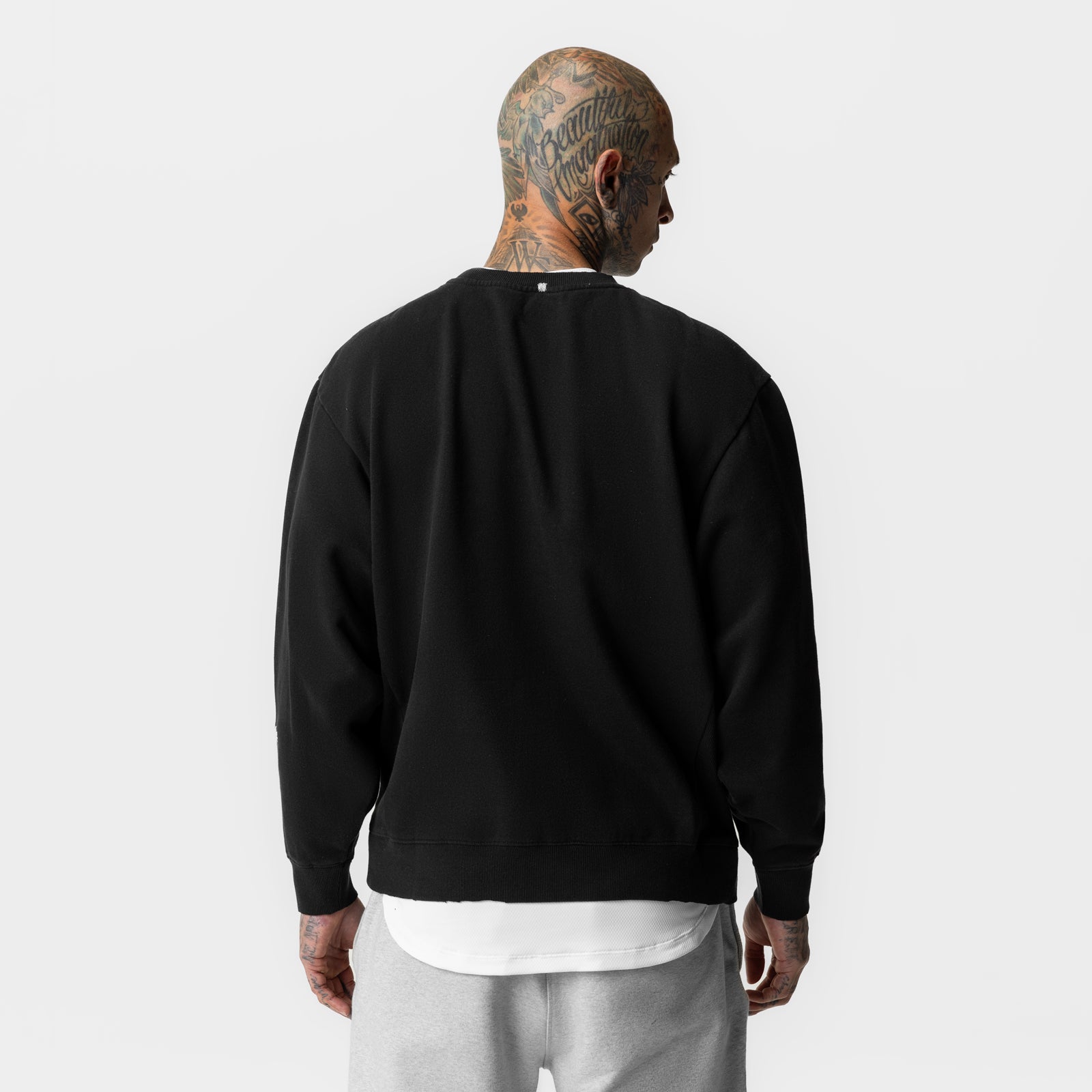 Black Tech Essential Distressed Crewneck worn by model, back view