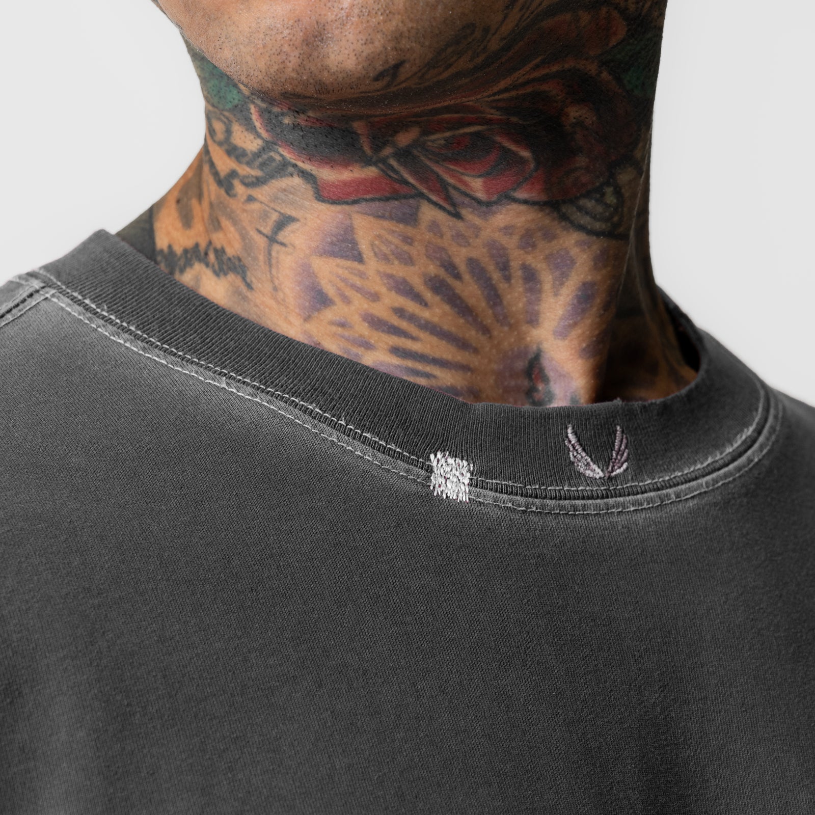 Tech Essential Relaxed Tee in faded grey worn by model, neck and shoulder detail view