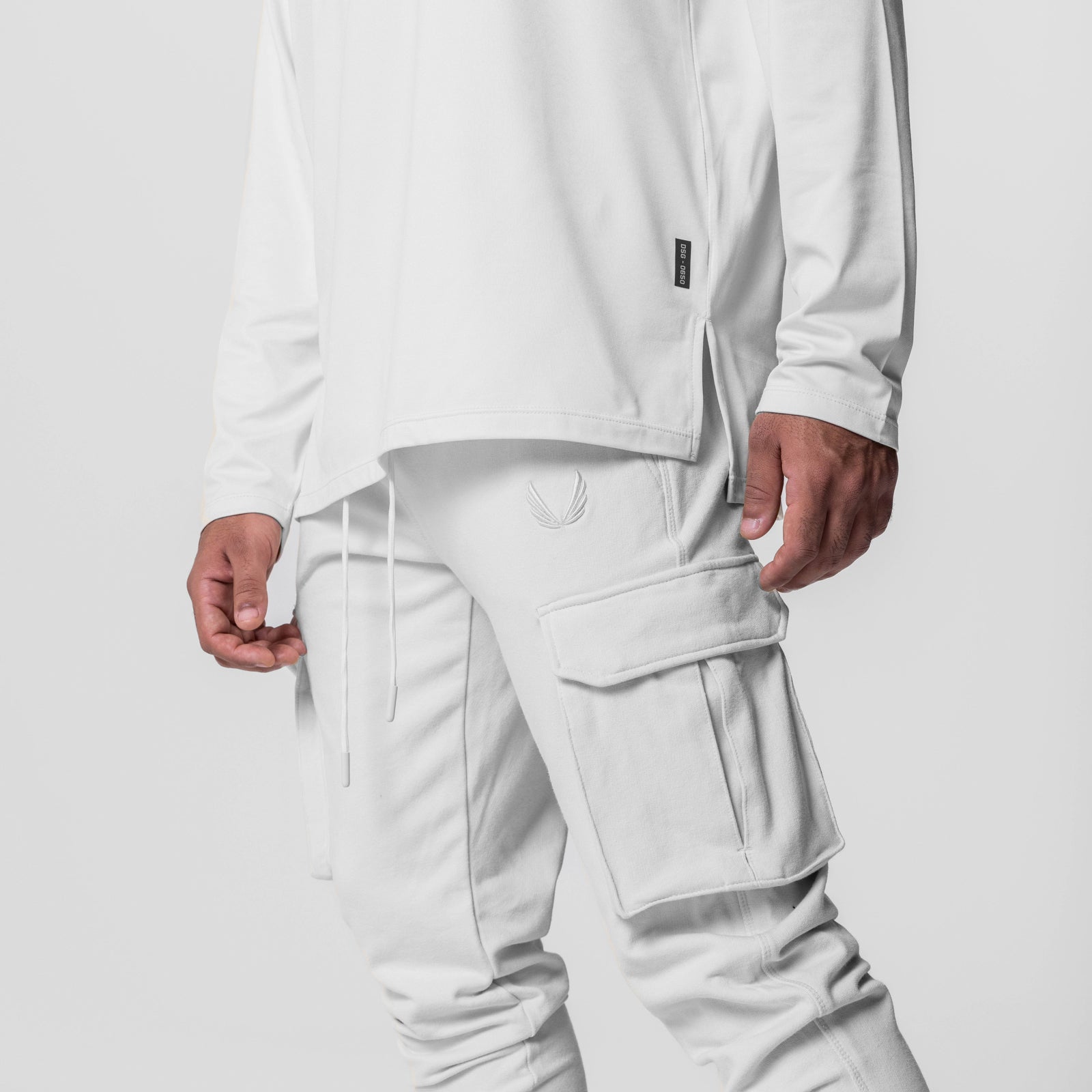 Tech-Terry Cargo High Rib Jogger in white, worn by model showing side view with cargo pockets