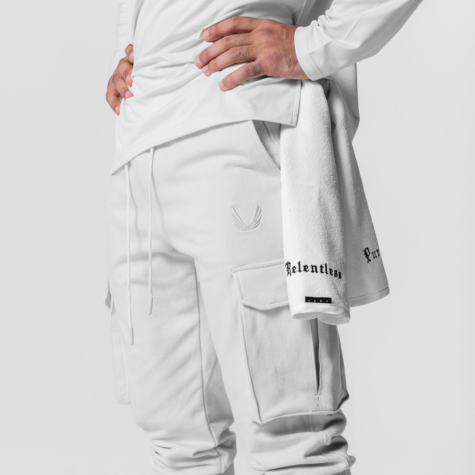 Tech-Terry Cargo High Rib Jogger in white, worn by model showing side view and cargo pockets