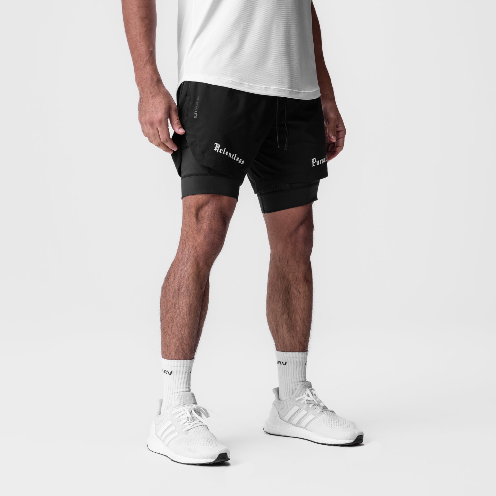 Tetra-Lite 7" Liner Short in black, worn with white socks and sneakers, front view