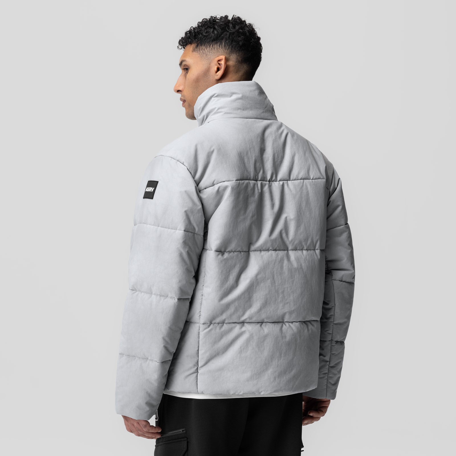 PrimaLoft Weather-Ready Puffer Jacket in grey, worn by model shown from back profile