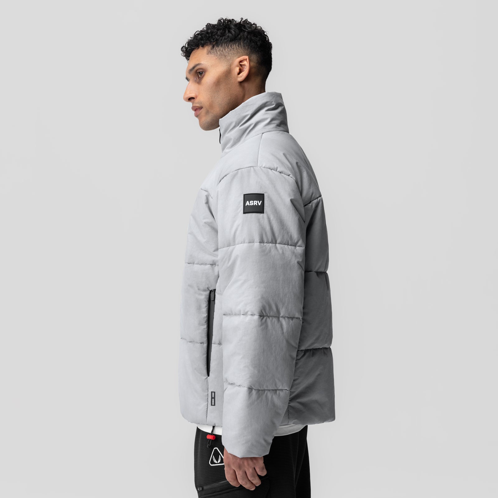 PrimaLoft Weather-Ready Puffer Jacket in grey, side profile view on model