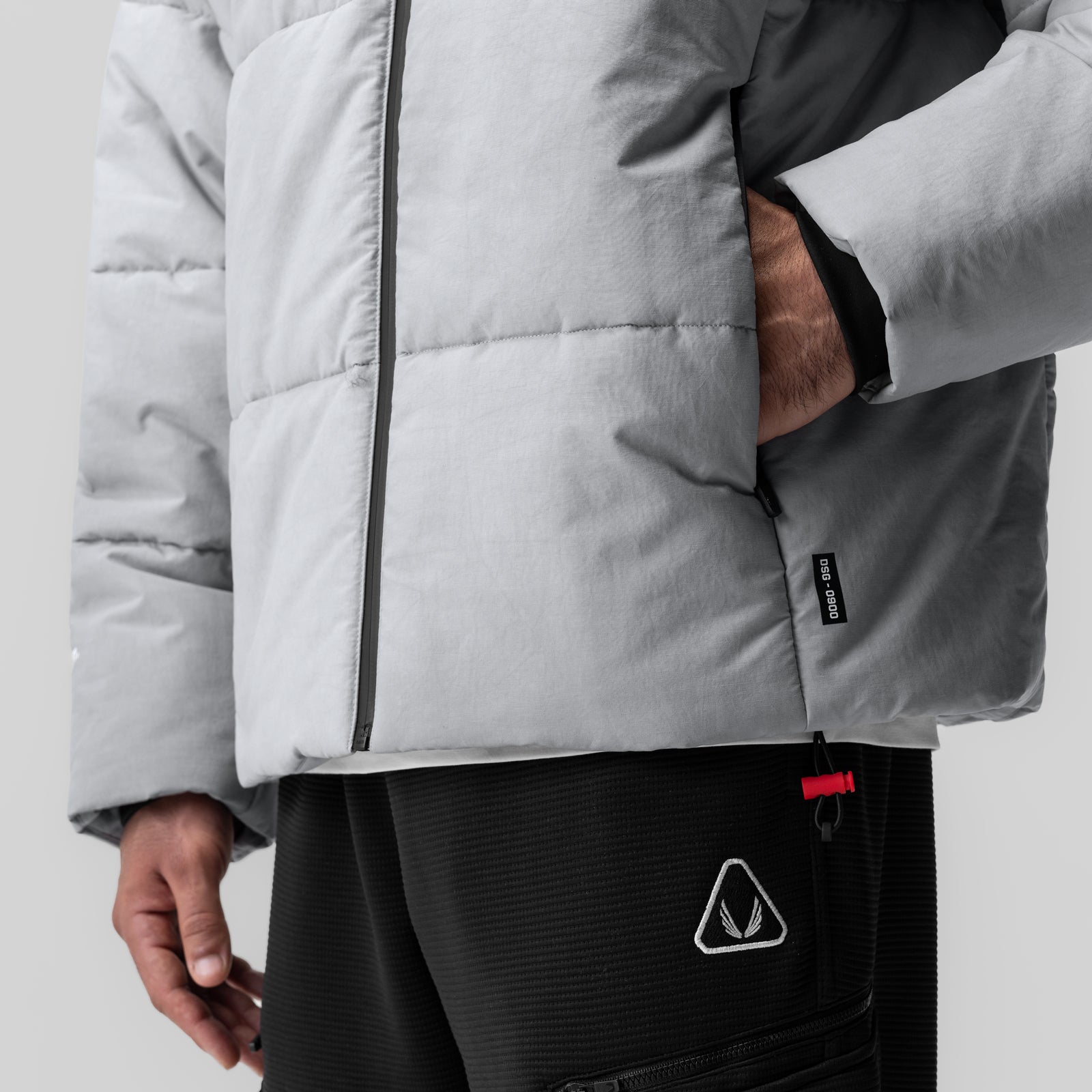 Grey PrimaLoft Weather-Ready Puffer Jacket worn by model, front detail view
