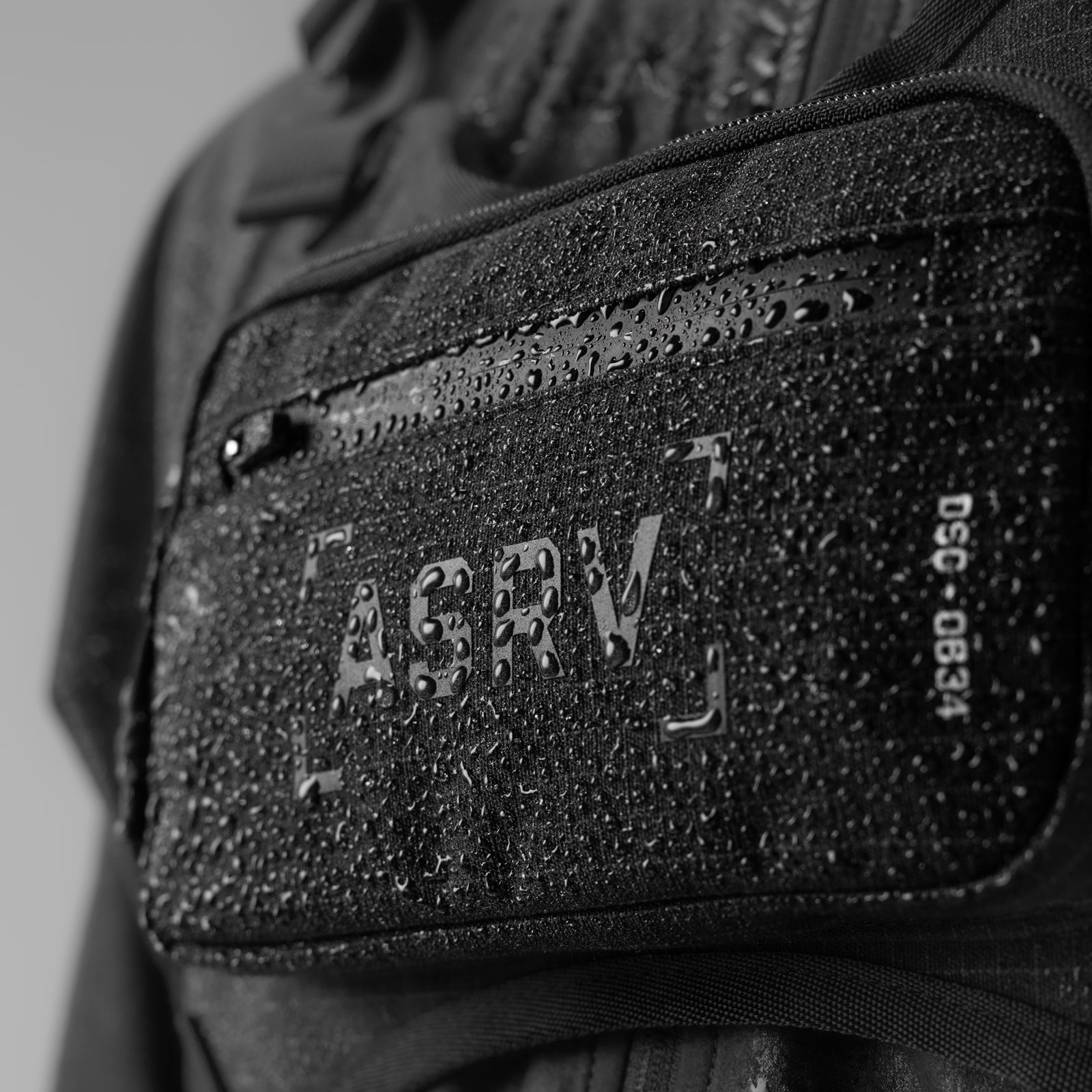 Conditioning Chest Pack in black grid, worn and carried detail closeup