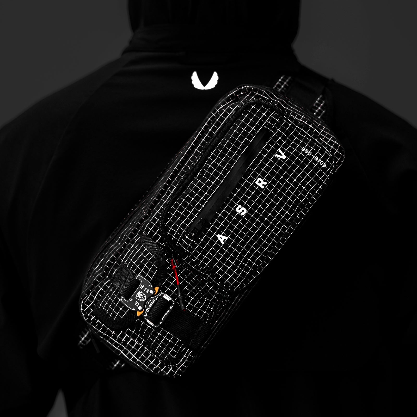 0703 Cordura Tech Crossbody Pack in Black Grid, worn on model's back