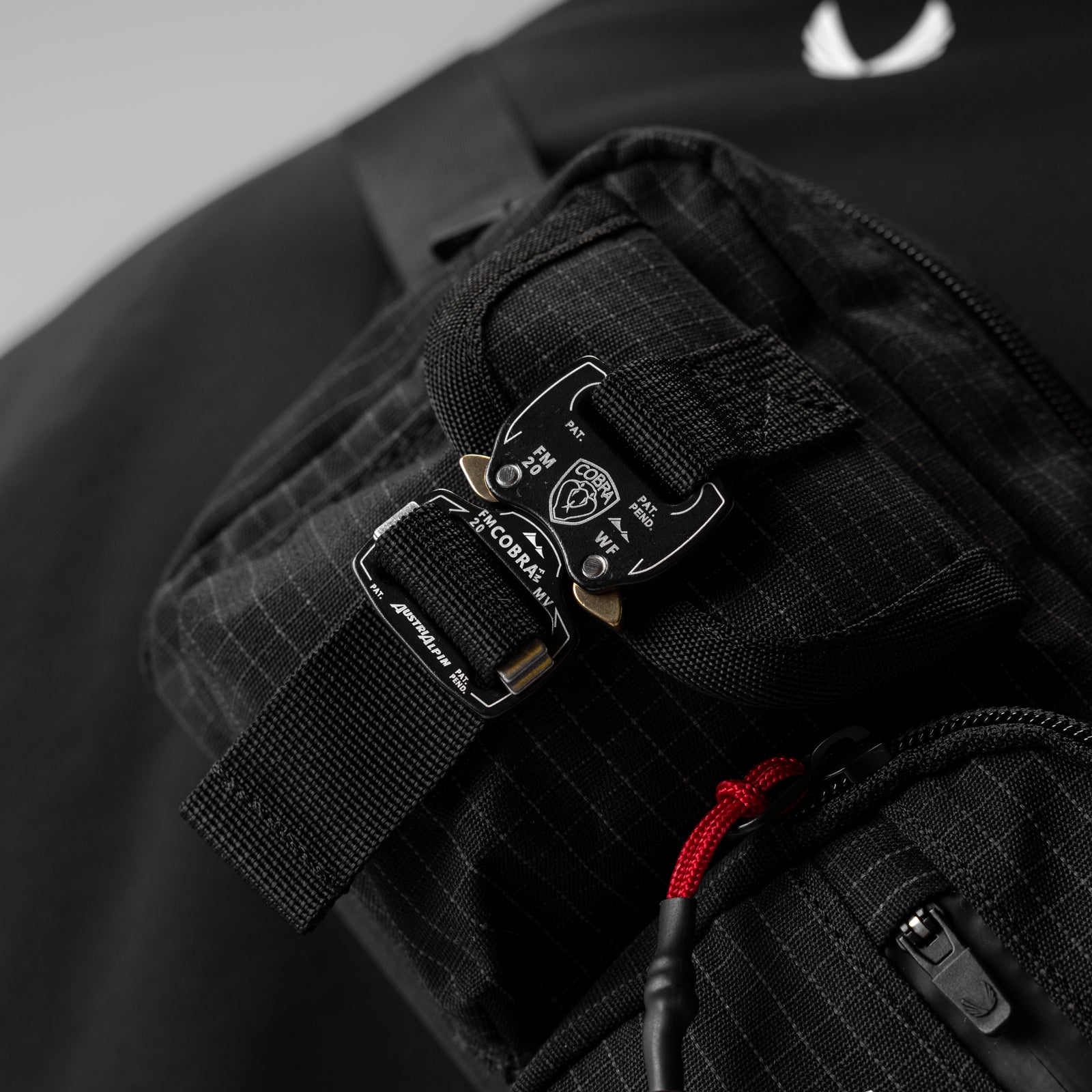0703 Cordura® Tech Crossbody Pack in Black Grid, worn and carried detail