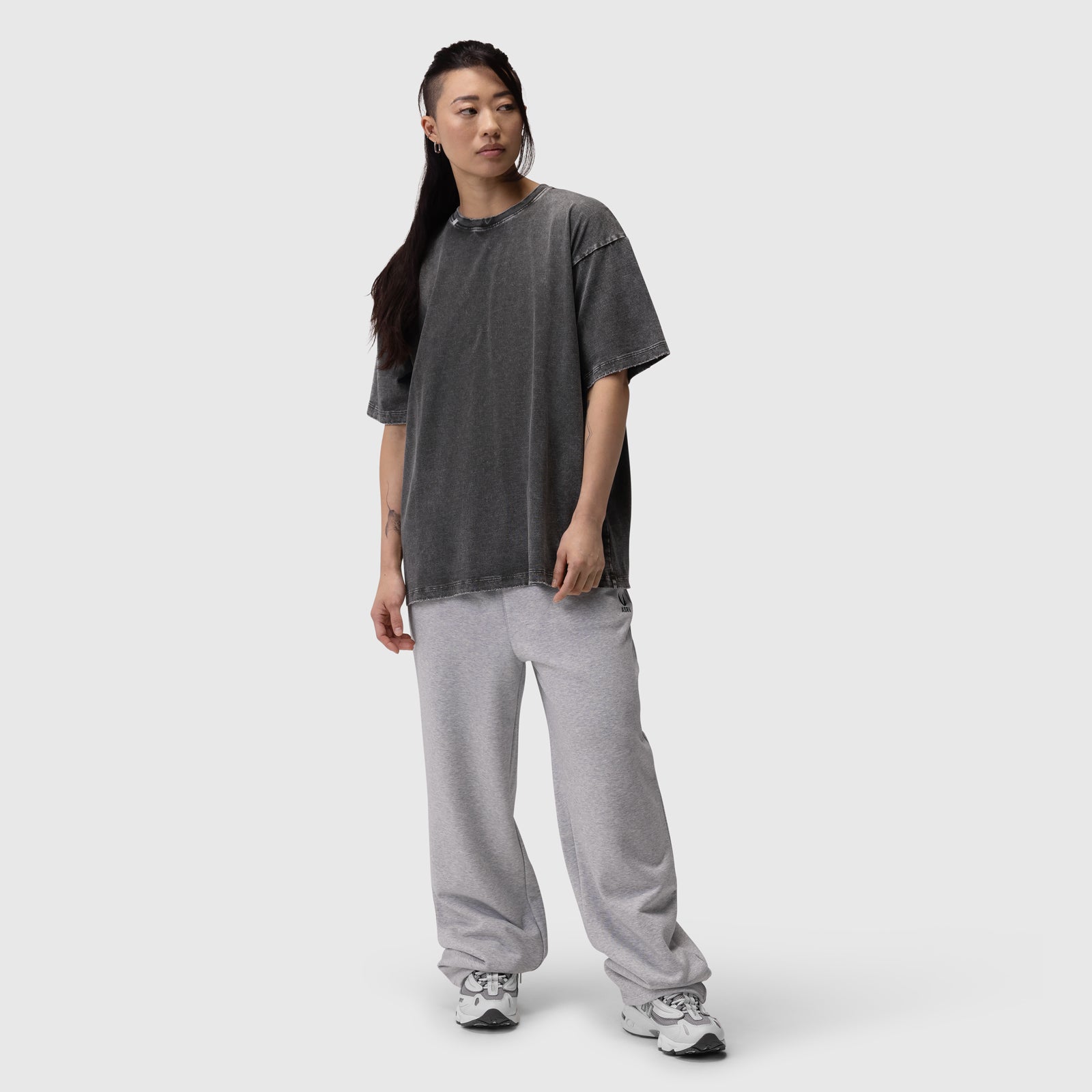Distressed Relaxed Tee in charcoal grey worn with grey sweatpants, front view