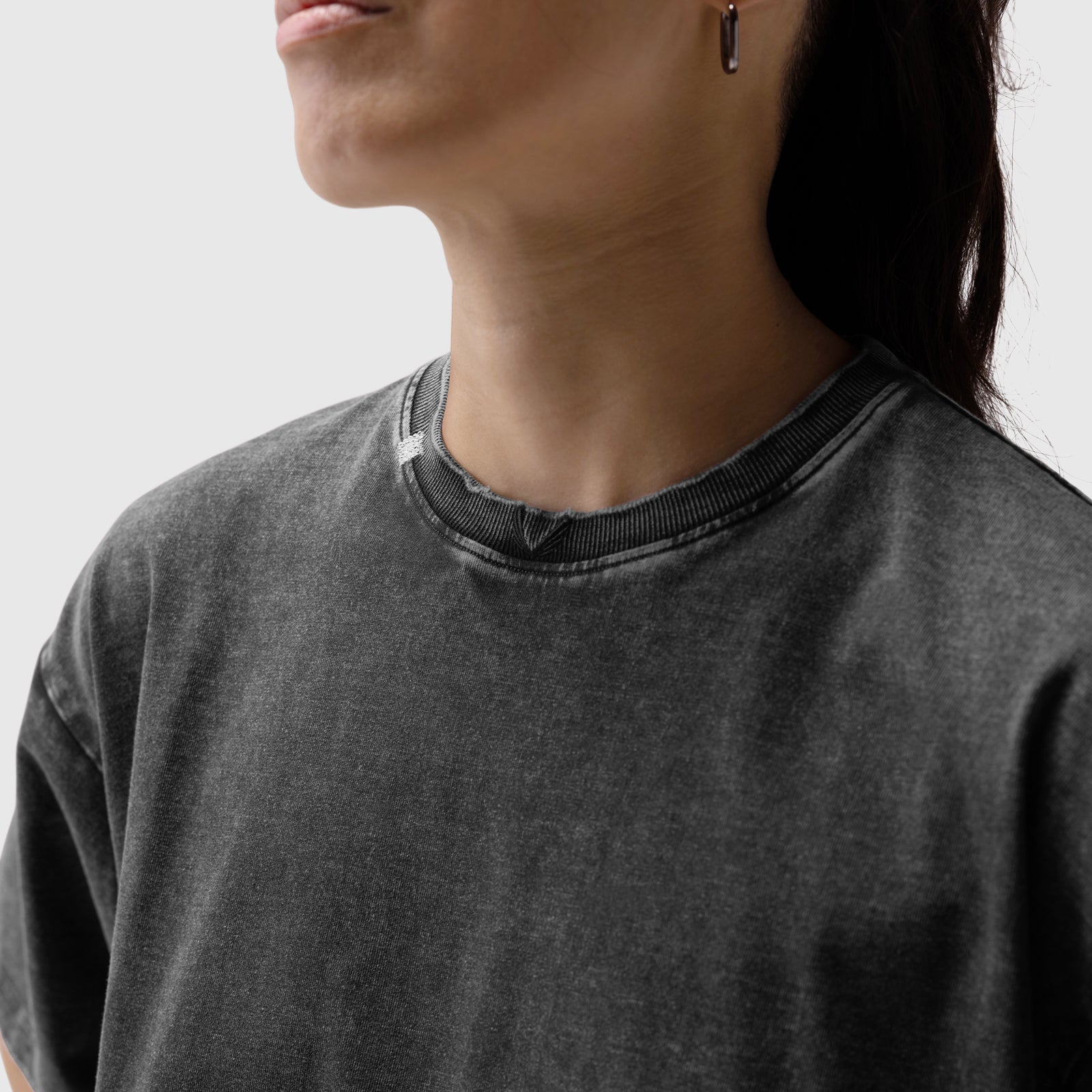 Distressed Relaxed Tee in black, worn by model, side view