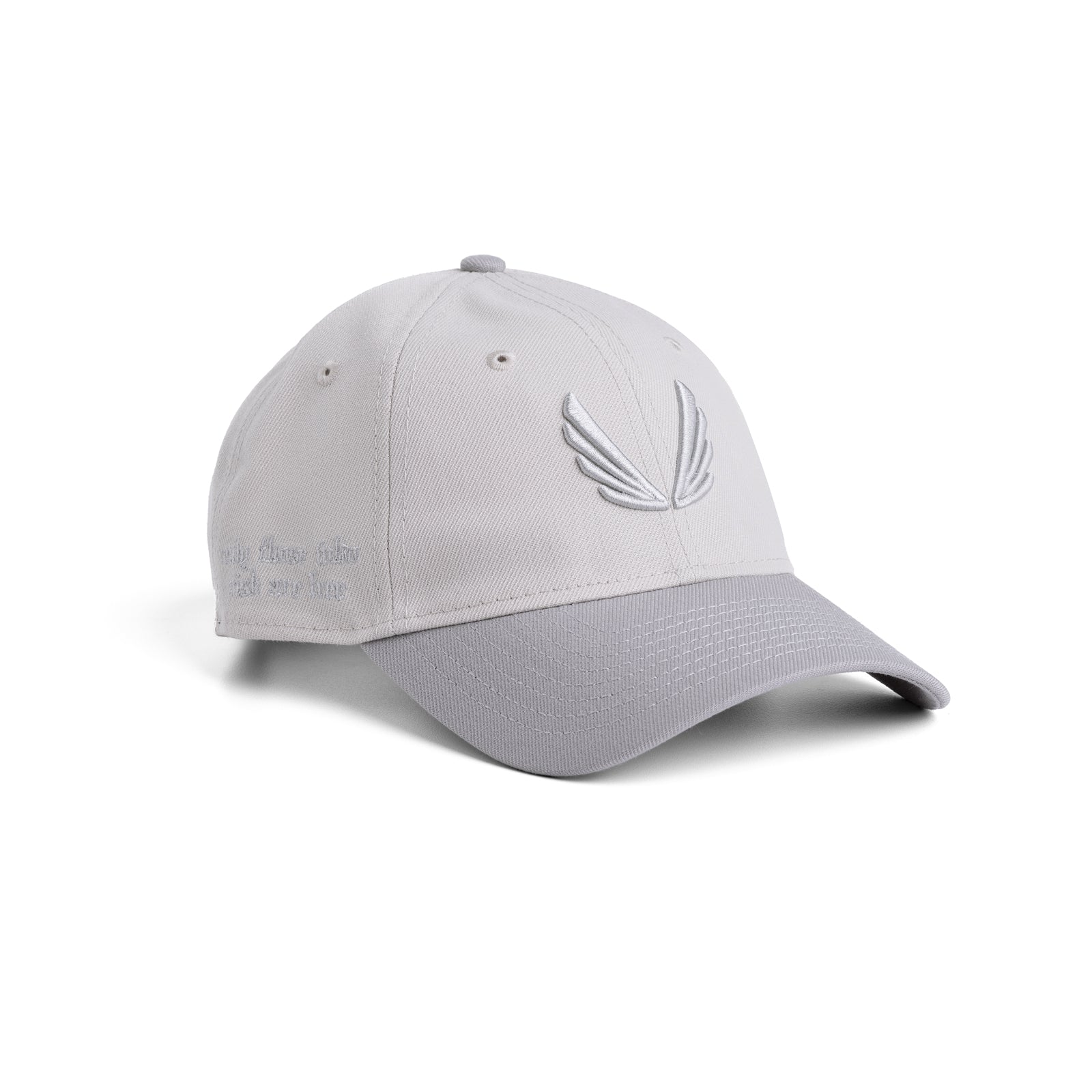 flatlay New Era 9Twenty Strapback Hat in stone and grey two-tone, angled front view