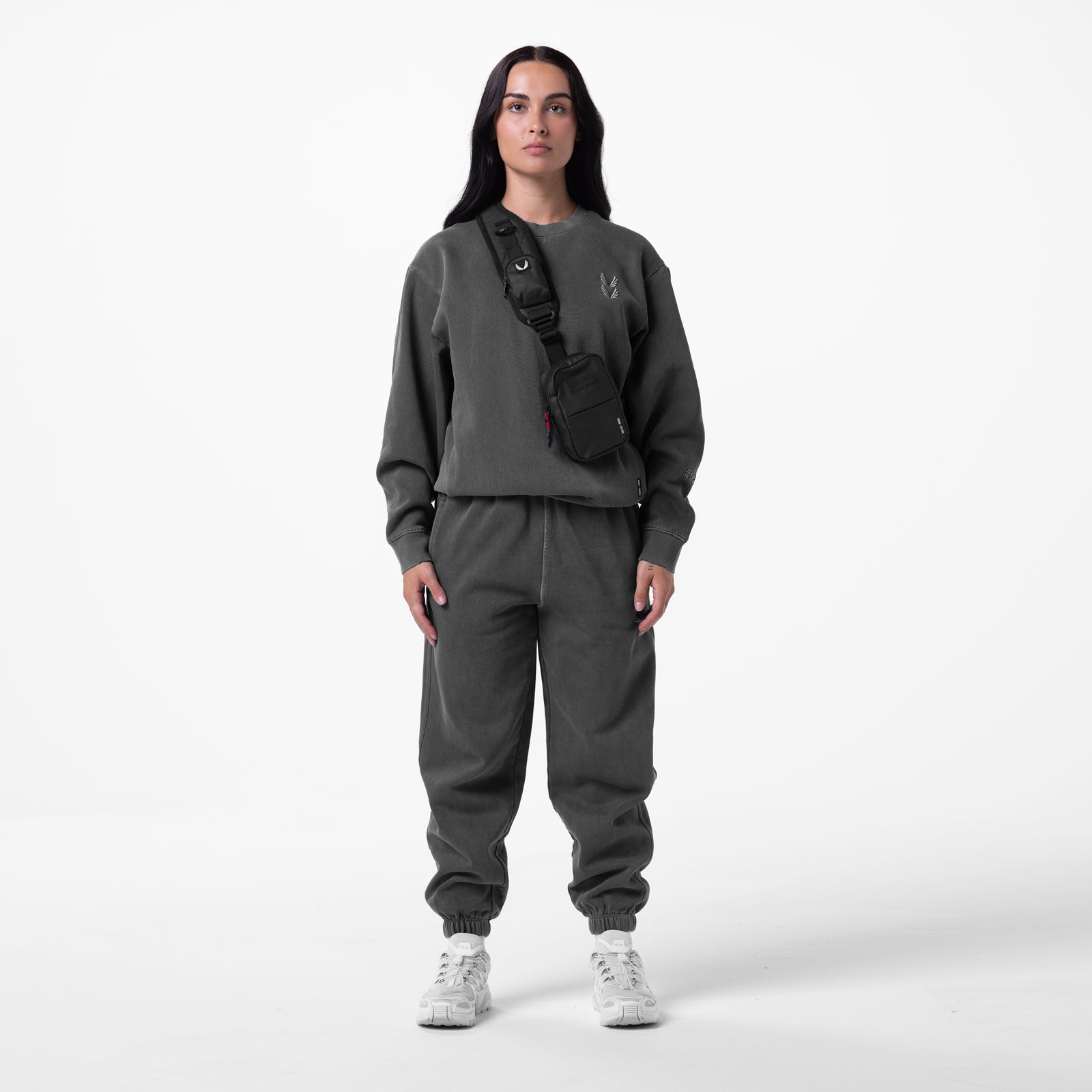 Tech Essential™ Sweats in Faded Grey worn with matching sweatshirt and black shoulder bag, front view
