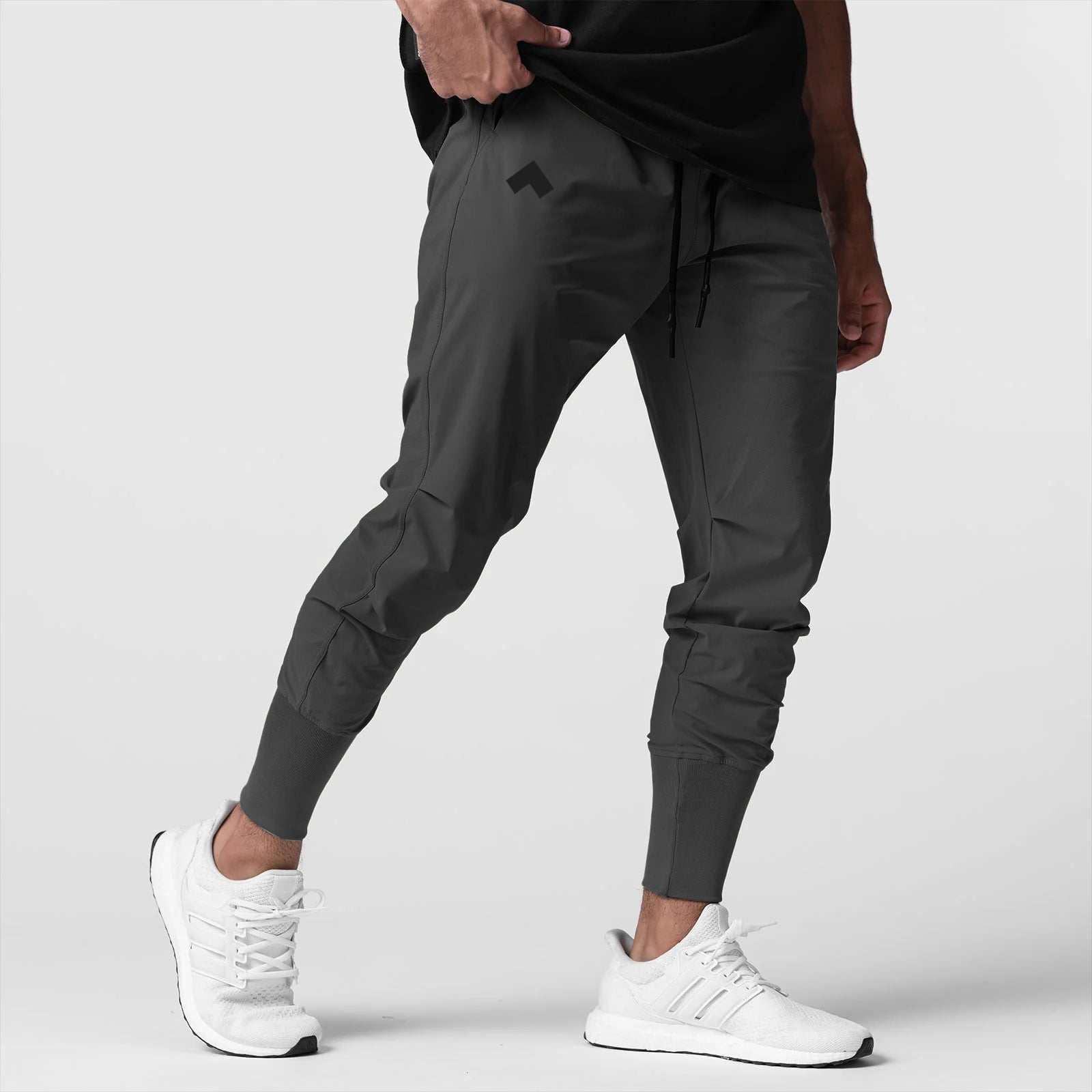 Space grey high rib jogger worn with white sneakers, side view