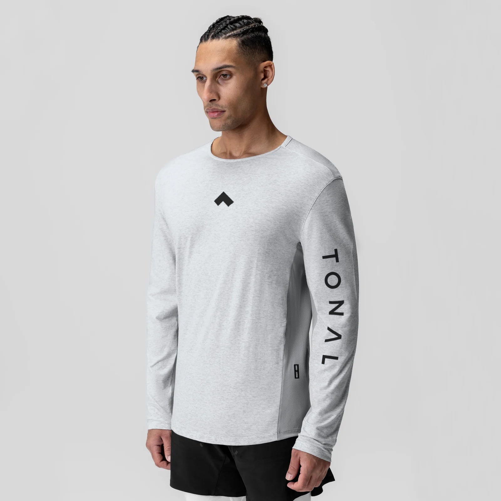 Heather grey long sleeve shirt with tonal branding, worn by model in front view