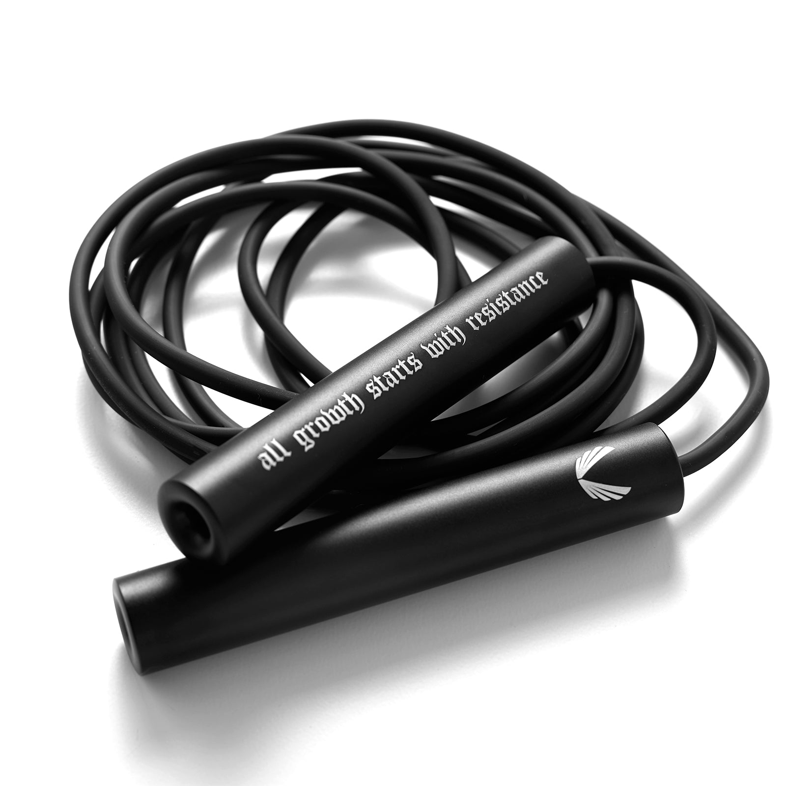 Flatlay of black Mantra Jump Rope with 'all growth starts with resistance' text, coiled on white background