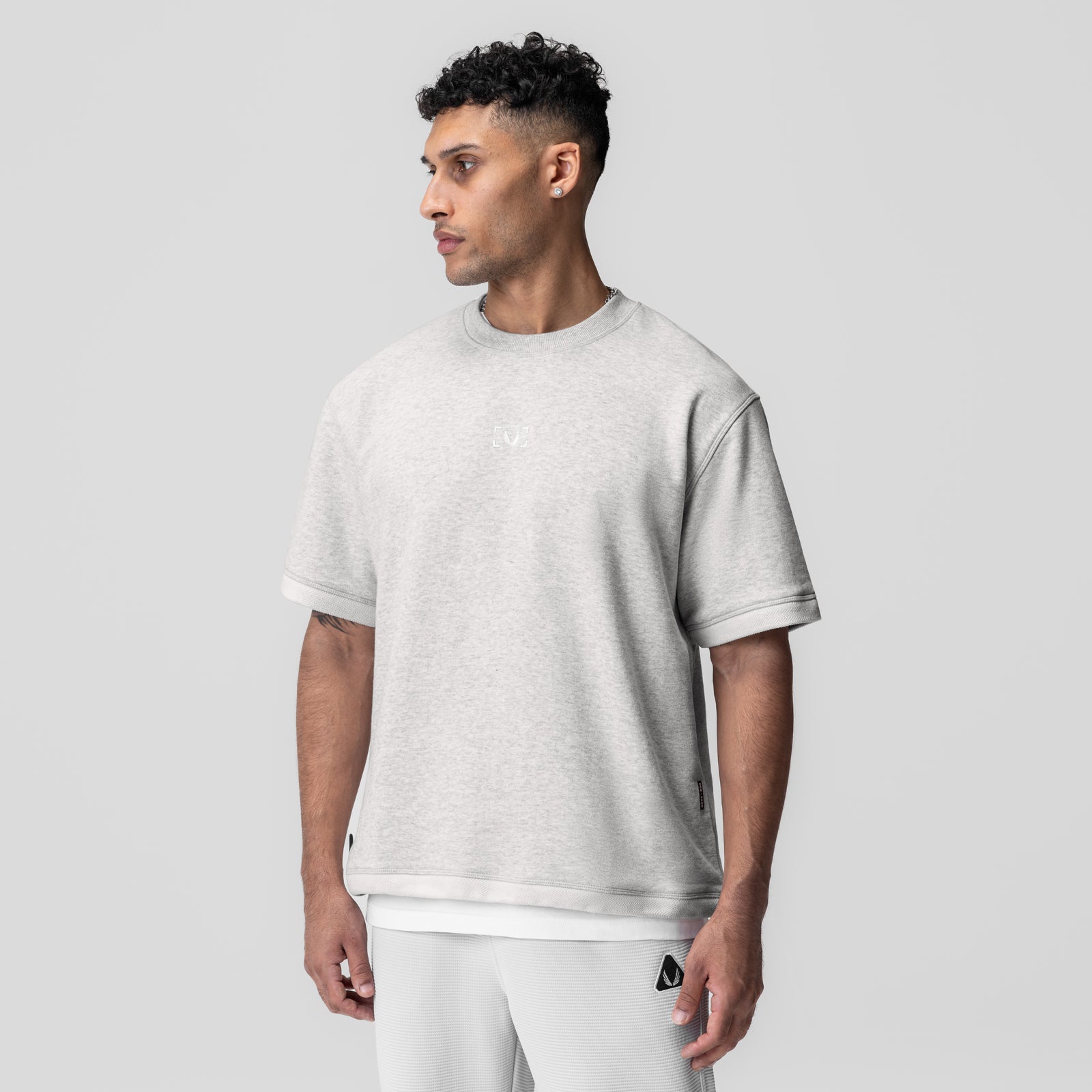 Herringbone Terry Oversized Cinch Tee in heather grey, worn by model in profile view